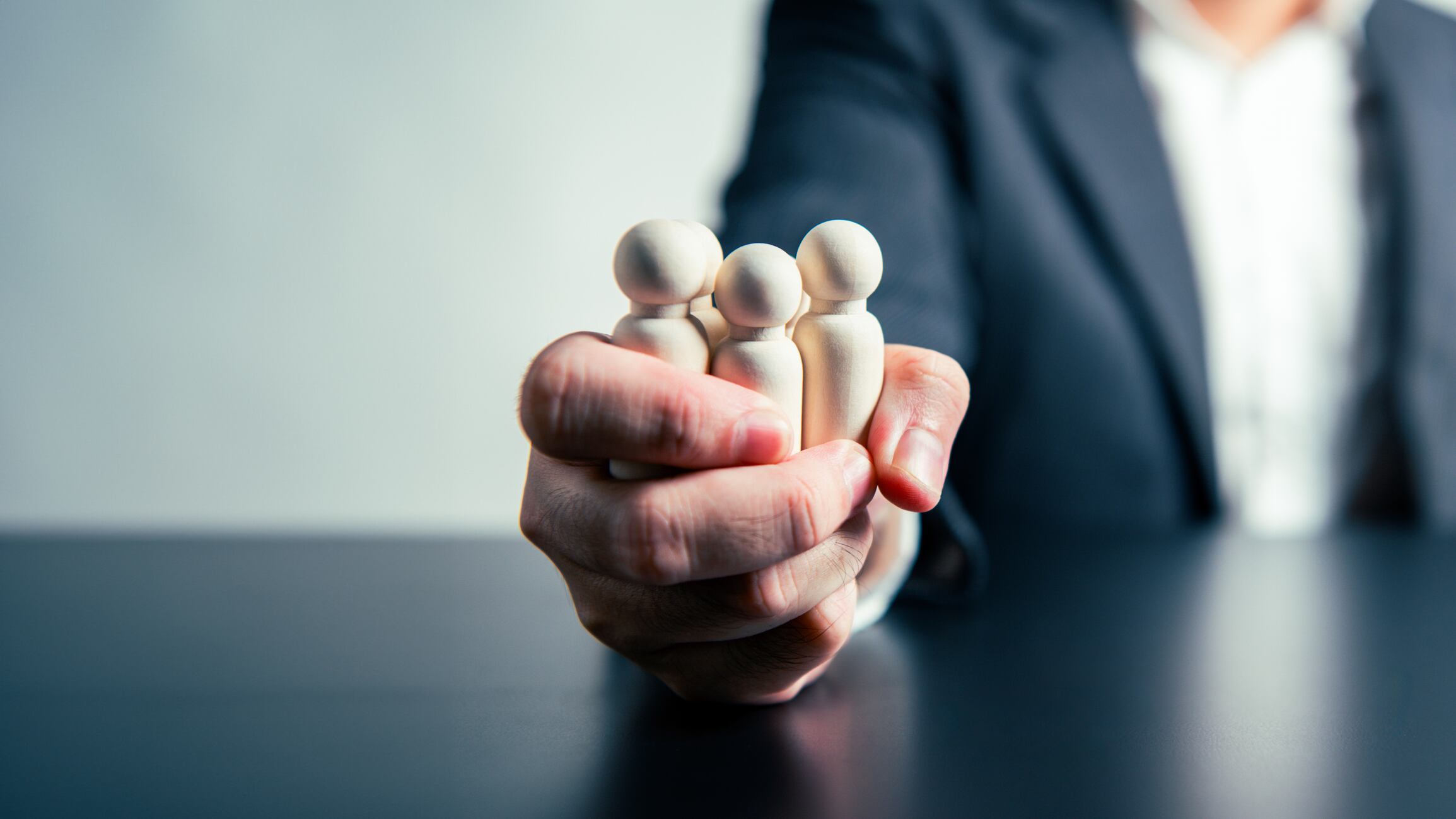 CEO Influence  Business Agreements and Employee Dismissals workforce labor businessman hand background. Tyrant and corruption concept.