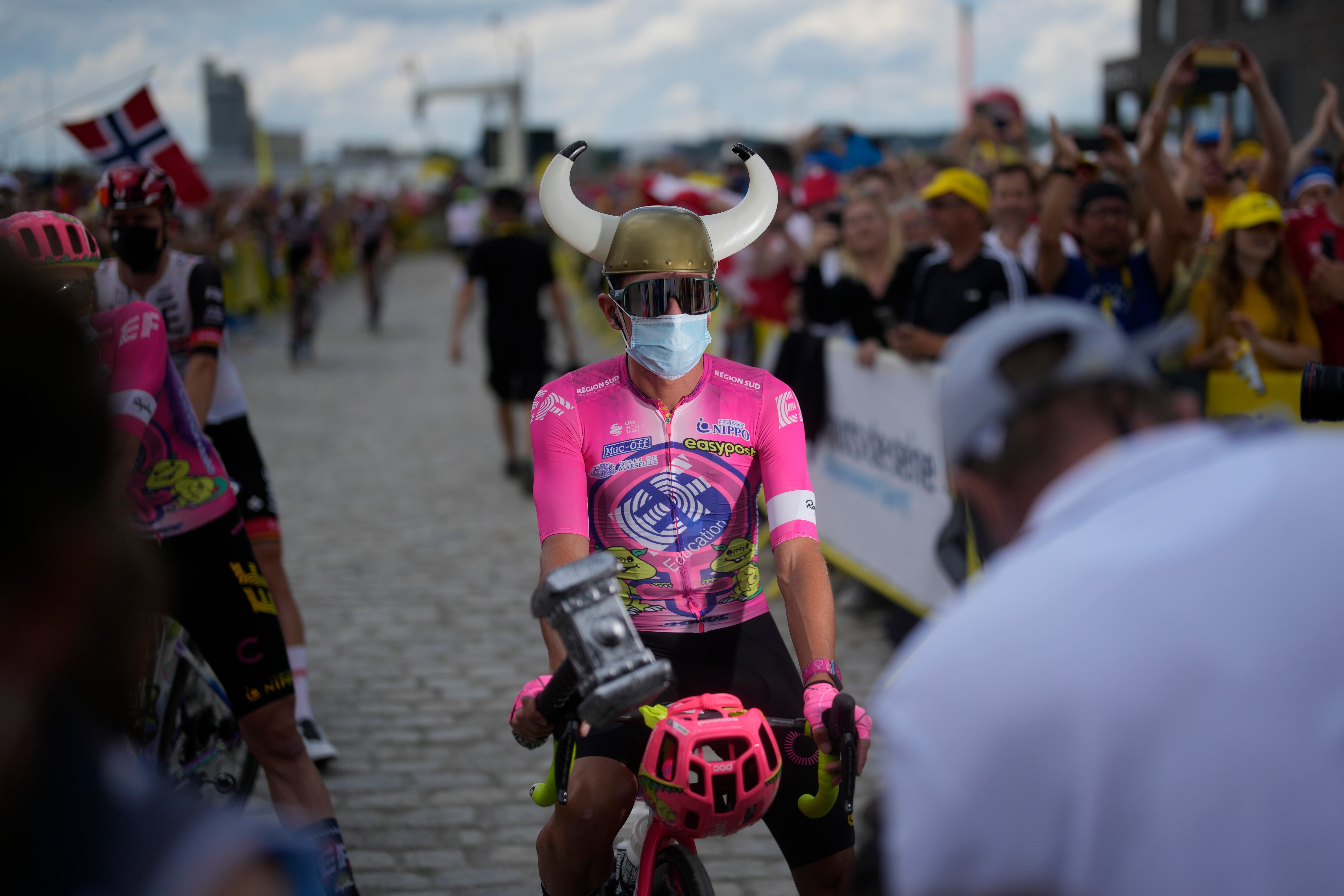 Colombia's Rigoberto Uran poses with a Viking helmet and a hammer prior to the third stage of the Tour de France cycling race over 182 kilometers (113 miles) with start in Vejle and finish in Sonderborg, Denmark, Sunday, July 3, 2022. (AP Photo/Thibault Camus)