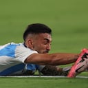 EAST RUTHERFORD, NEW JERSEY - JUNE 25: Nicolas Gonzalez of Argentina grabs the ankle of a chilean player during the CONMEBOL Copa America 2024 match between Chile and Argentina at MetLife Stadium on June 25, 2024 in East Rutherford, New Jersey. (Photo by Rob Carr/Getty Images)