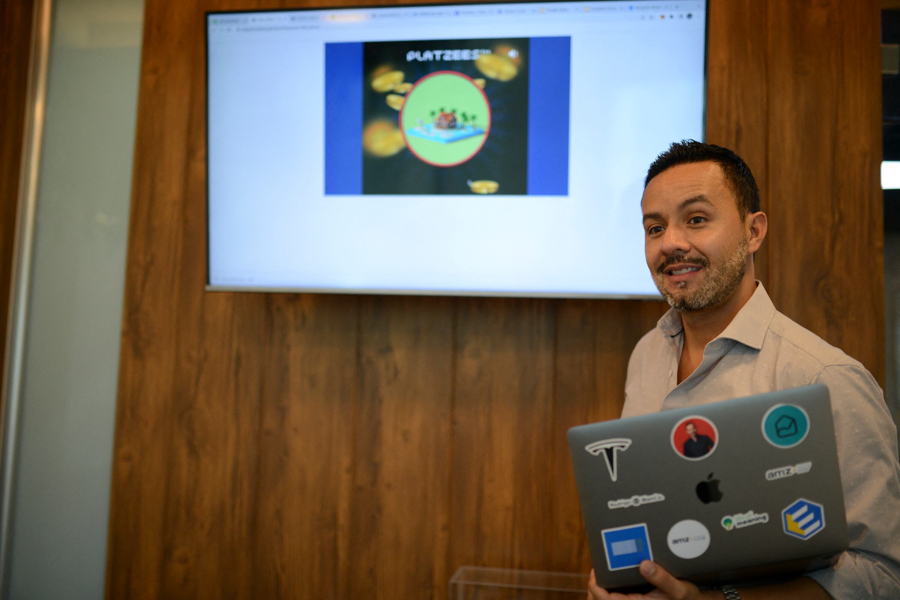 Rodrigo Blanco, Guatemalan entrepreneur, CEO and founder of Portafolio Diversificado (a private real estate investment fund), speaks during an interview with AFP in Guatemala City on May 3, 2022. - The first step of the Guatemalan metaverse began with the sale at the end of April of 5,000 "Platzees": exotic "collectible" properties surrounded by animals, Formula 1 cars, mythological beings and other "rarities" at a cost starting at US$500. (Photo by Johan ORDONEZ / AFP)