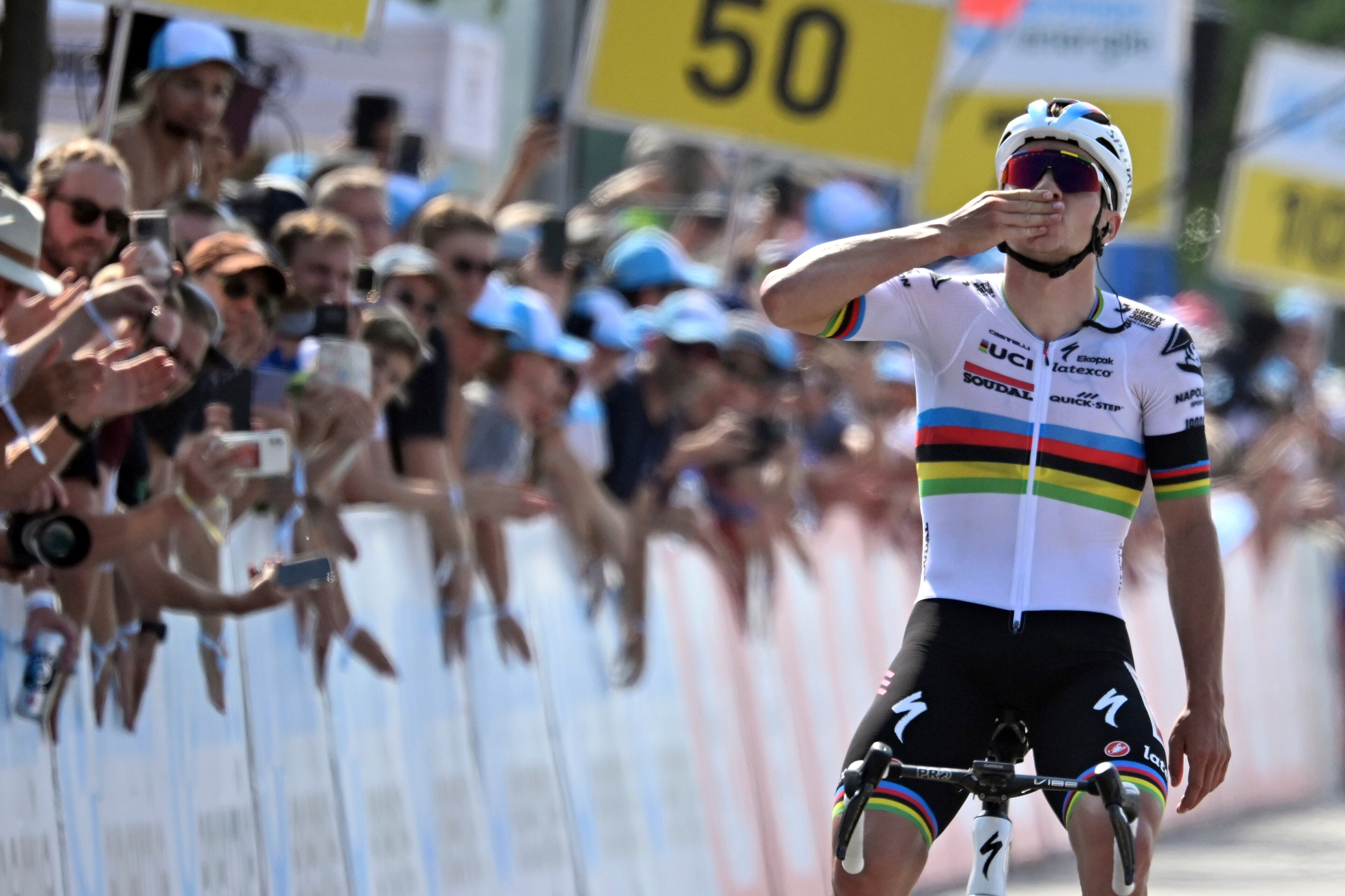 Remco Evenepoel from Belgium of Soudal-Quick Step crosses the finish line as winner of the seventh stage, a 174 km race from Tuebach to Weinfelden, at the 86th Tour de Suisse UCI World Tour cycling race, in Weinfelden, Switzerland, Saturday, June 17, 2023. (Gian Ehrenzeller/Keystone via AP)