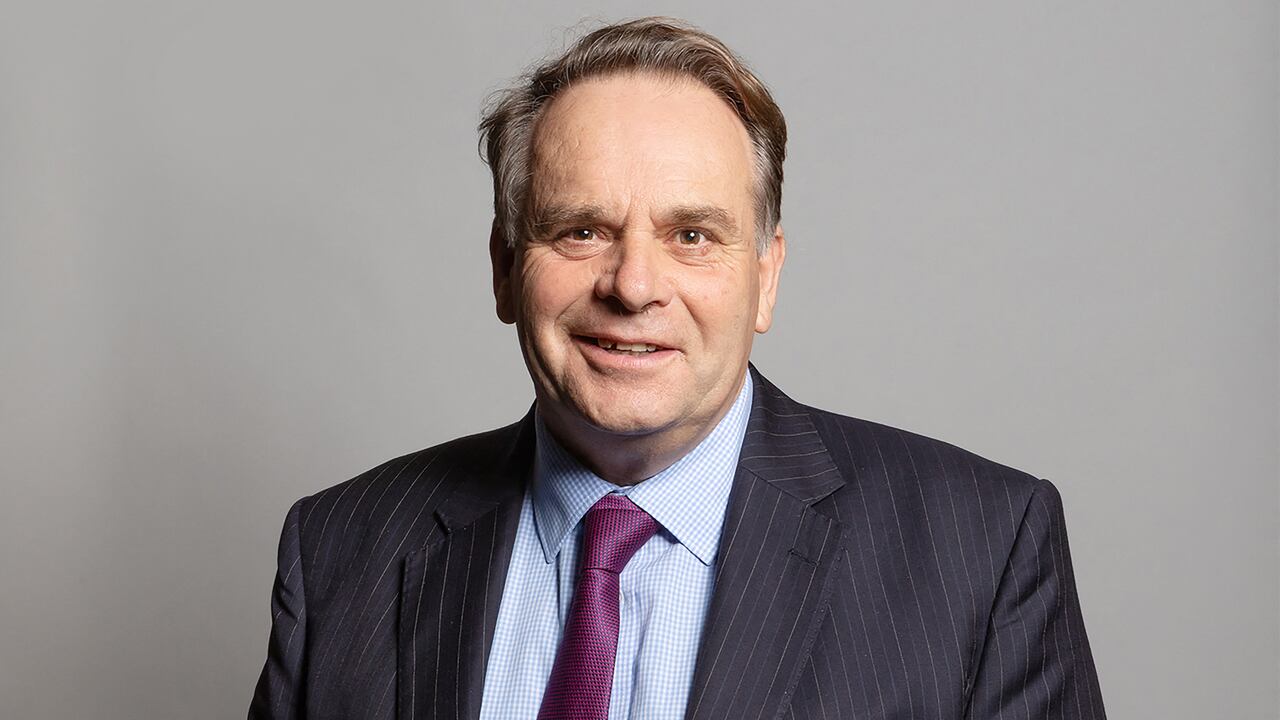 An undated handout photograph released by the UK Parliament shows Conservative MP for Tiverton and Honiton, Neil Parish, posing for an official portrait photograph at the Houses of Parliament in London. - Britain's ruling Conservative party on Friday suspended one of its MPs pending an investigation into claims he watched pornography on his mobile phone in the House of Commons chamber. The identification of MP Neil Parish, 65, ends days of speculation since the allegation emerged on Tuesday, amid accusations of a misogynistic environment in parliament. (Photo by Richard Townshend / UK PARLIAMENT / AFP) / RESTRICTED TO EDITORIAL USE - NO USE FOR ENTERTAINMENT, SATIRICAL, ADVERTISING PURPOSES - MANDATORY CREDIT " AFP PHOTO / RICHARD TOWNSHEND /UK Parliament"