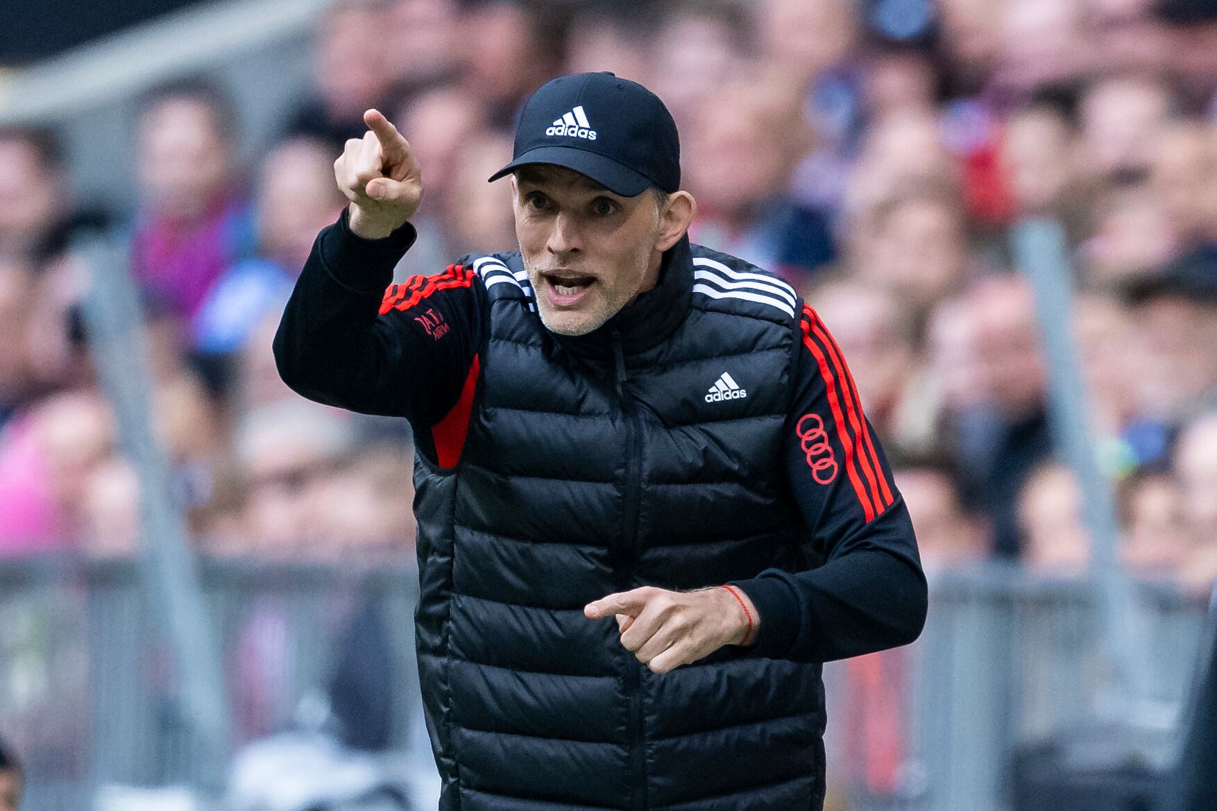 Munich's head coach Thomas Tuchel points during the German Bundesliga soccer match between FC Bayern Munich and FC Schalke 04 in Munich, Germany, Saturday, May 13, 2023. (Tom Weller/dpa via AP)