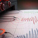 Seismograph printing seismic activity records of a severe earthquake.