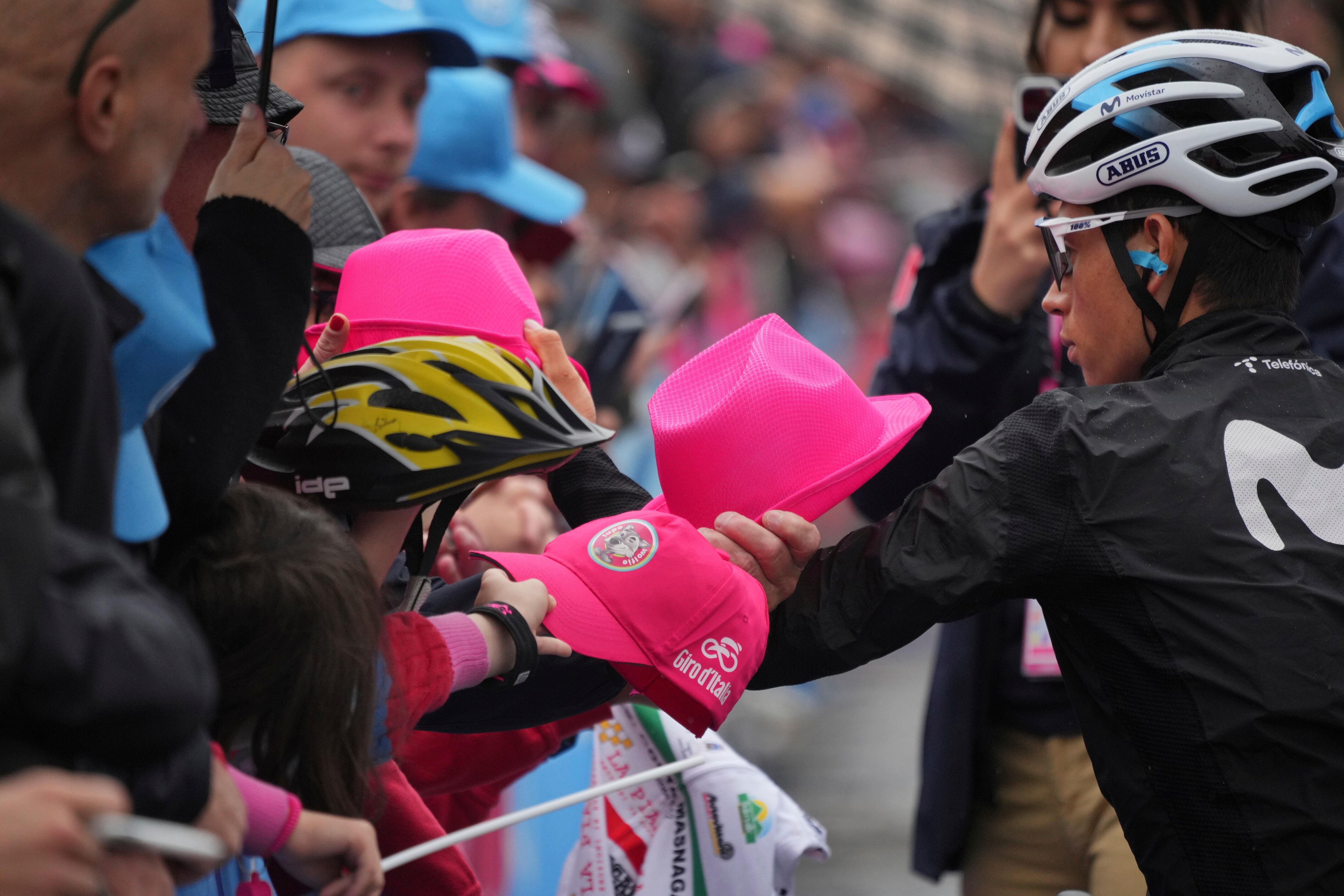 Colombia's Einer Augusto Rubio signs autographs, ahead of the start of the 15th stage of the Giro D'Italia, tour of Italy cycling race from Seregno to Bergamo, Italy, Sunday, May 21, 2023.  (Gian Mattia D'Alberto/LaPresse via AP)