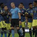 Players of Colombia complain to Referee Nestor Pitana, of Argentina, during a Copa America soccer match against Brazil at Nilton Santos stadium in Rio de Janeiro, Brazil, Wednesday, June 23, 2021. (AP Photo/Silvia Izquierdo)