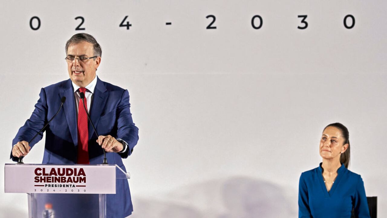 MEXICO CITY, MEXICO - JUNE 20: Marcelo Ebrard speaks as President-elect of Mexico Claudia Sheinbaum looks at him during the announcement of the new Government Cabinet at MIDE- Museo Interactivo de Economía on June 20, 2024 in Mexico City, Mexico. Sheinbaum confirmed Ebrard as the Secretary of Economy. (Photo by Jaime Nogales/Medios y Media/Getty Images)