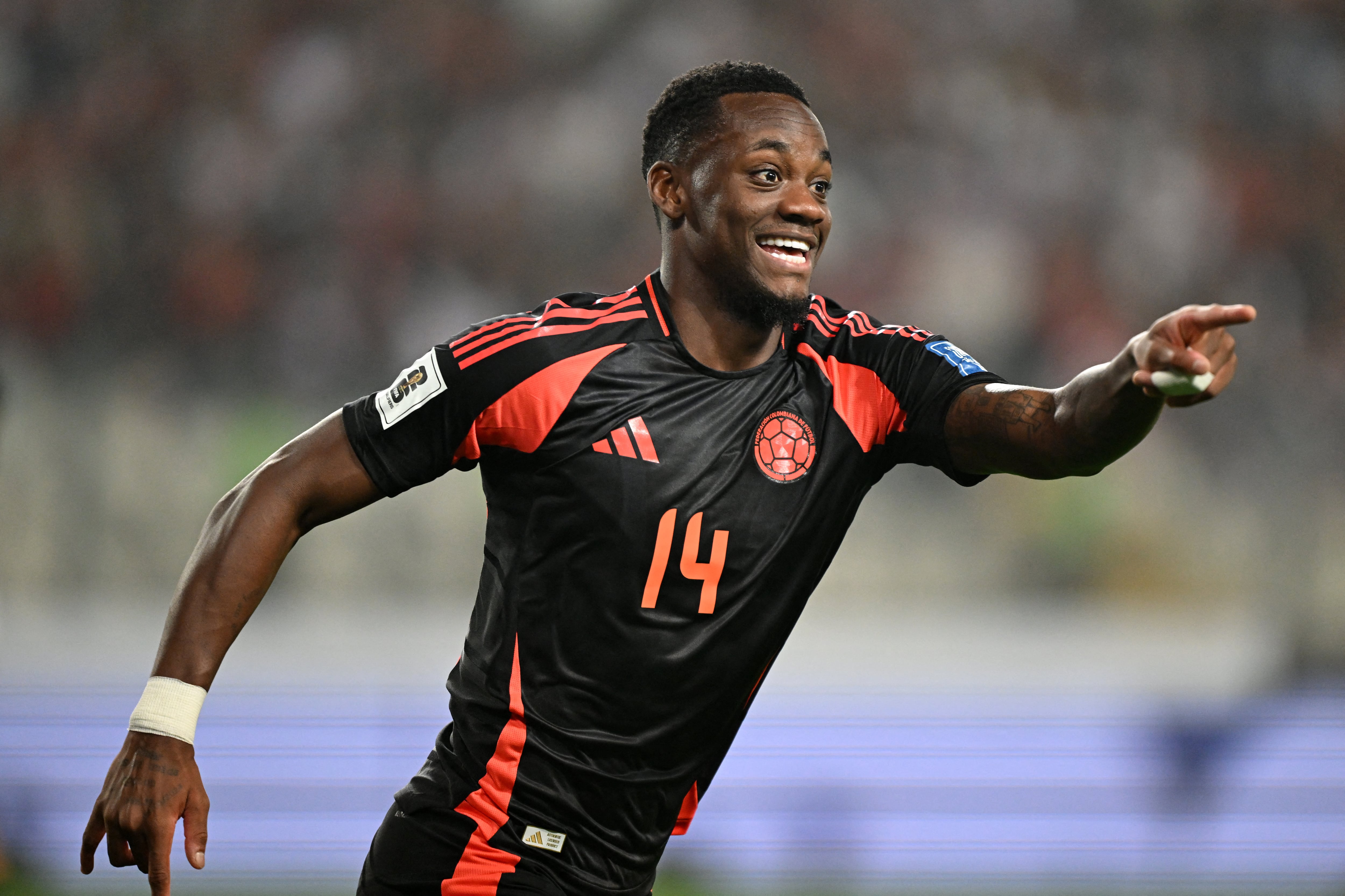 Colombia's forward Jhon Dur�n celebrates the goal of his teammate forward Luis Diaz (out of frame) during the 2026 FIFA World Cup South American qualifiers football match between Peru and Colombia, at the Monumental stadium in Lima, on September 6, 2024. (Photo by ERNESTO BENAVIDES / AFP)