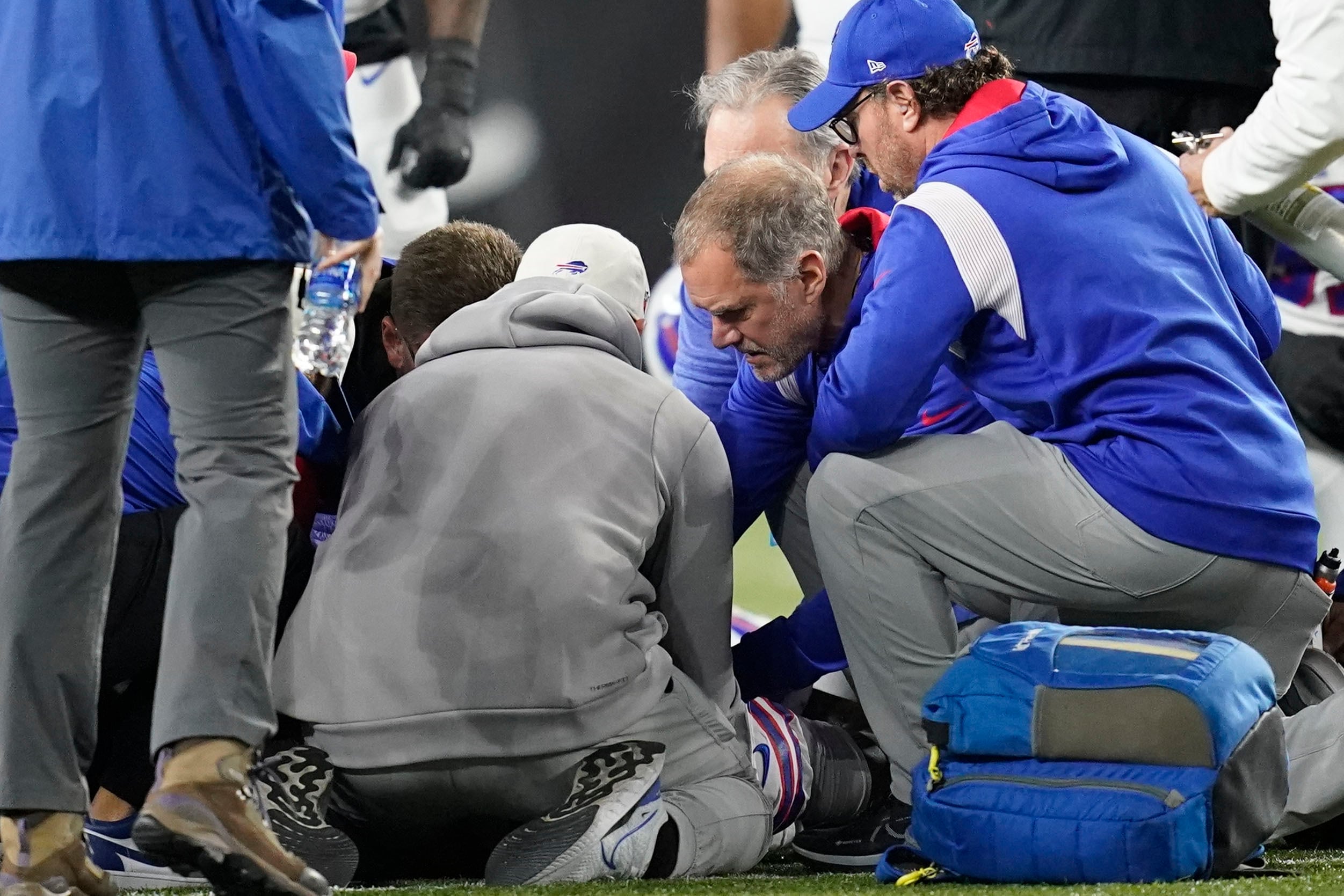 Buffalo Bills' Damar Hamlin is examined during the first half of an NFL football game against the Cincinnati Bengals, Monday, Jan. 2, 2023, in Cincinnati. The game has been postponed after Buffalo Bills' Damar Hamlin collapsed, NFL Commissioner Roger Goodell announced. (AP Photo/Joshua A. Bickel)