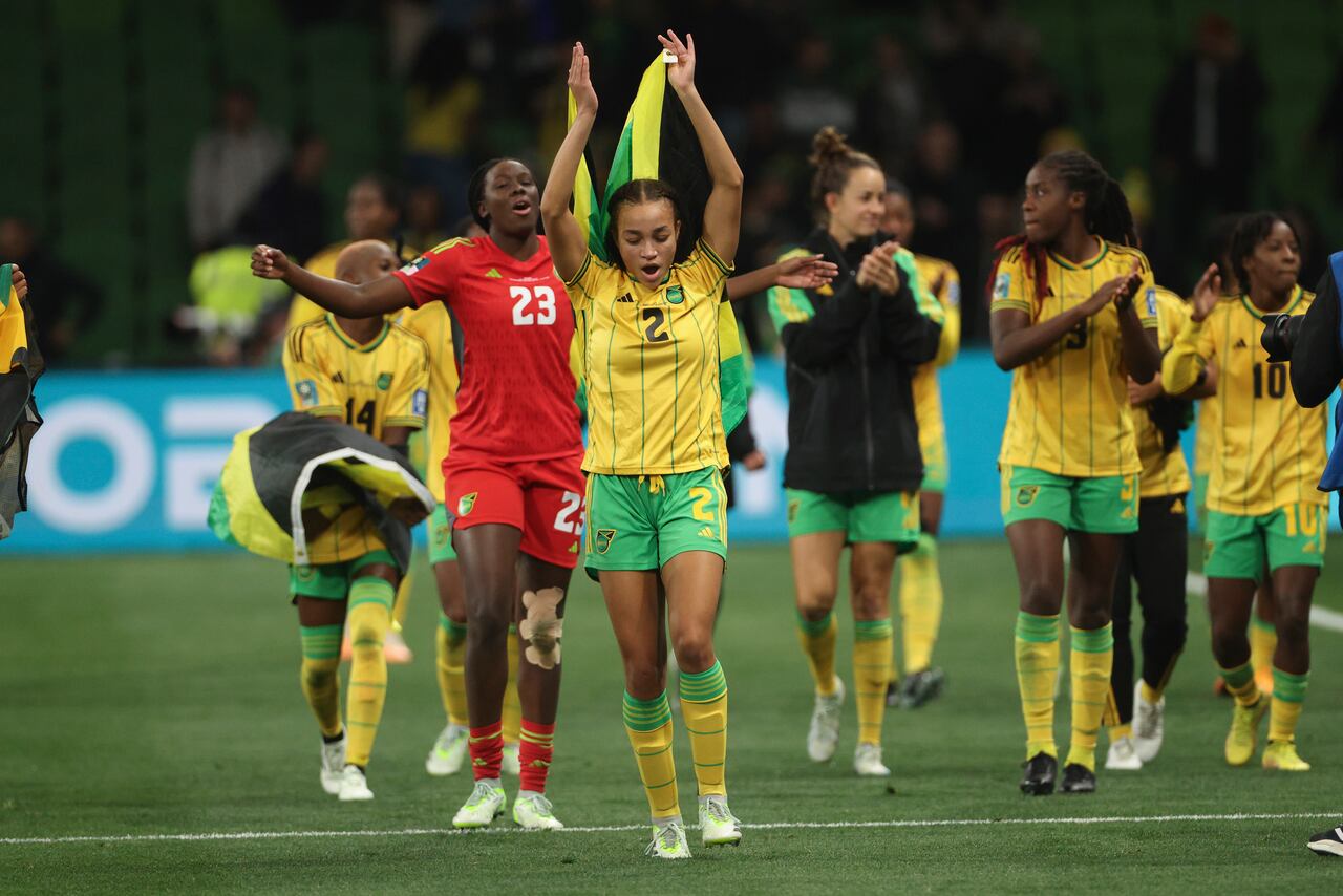 Jamaica's Solai Washington, centre, celebrate with her teammate after drawing a 0-0 tie during the Women's World Cup Group F soccer match between Jamaica and Brazil in Melbourne, Australia, Wednesday, Aug. 2, 2023. (AP Photo/Hamish Blair)