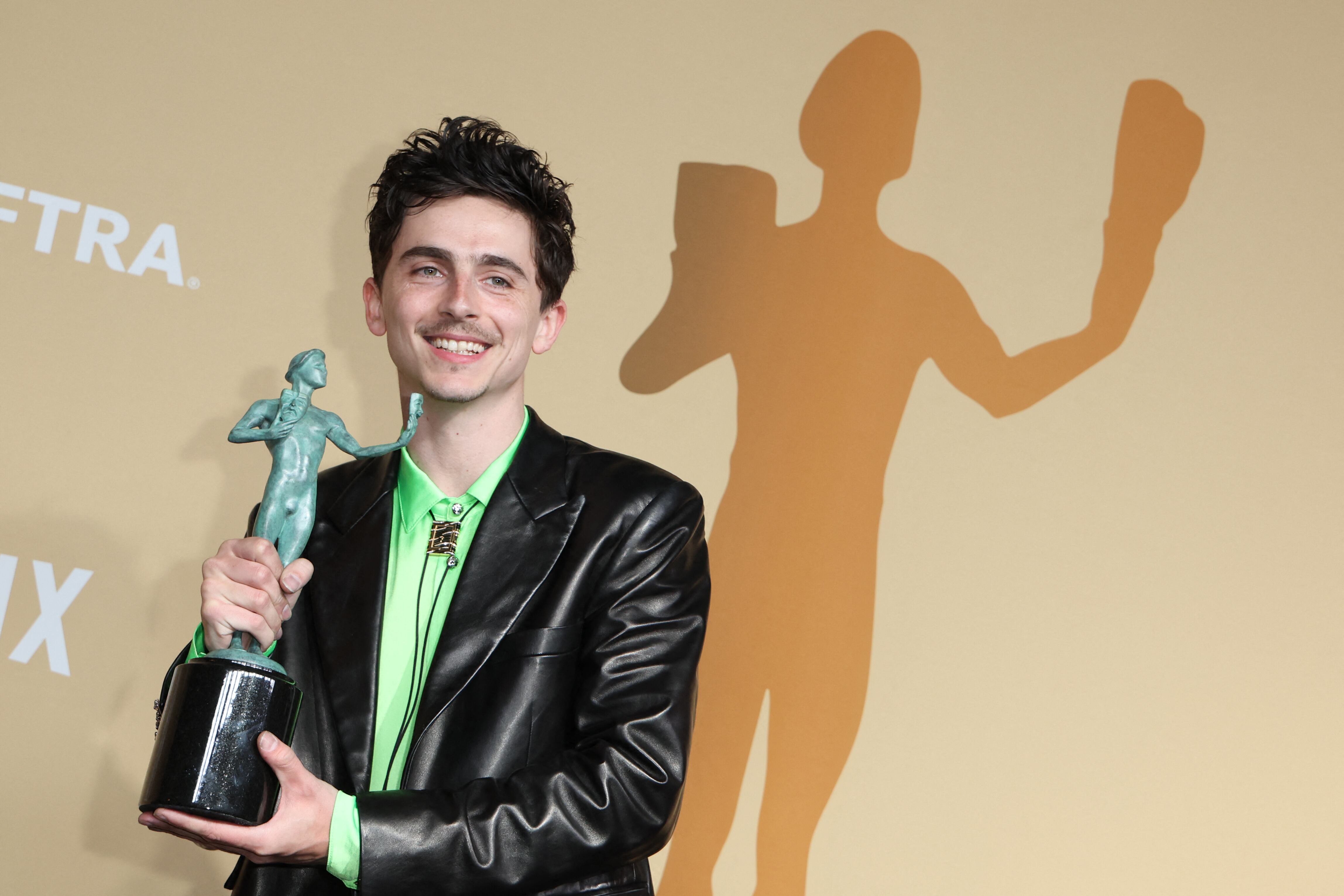 US-French actor Timothee Chalamet poses in the press room with the award for Outstanding Performance by a Male Actor in a Leading Role in a Motion Picture for "A Complete Unknown" during the 31st Annual Screen Actors Guild awards at the Shrine Auditorium in Los Angeles, February 23, 2025. (Photo by VALERIE MACON / AFP)