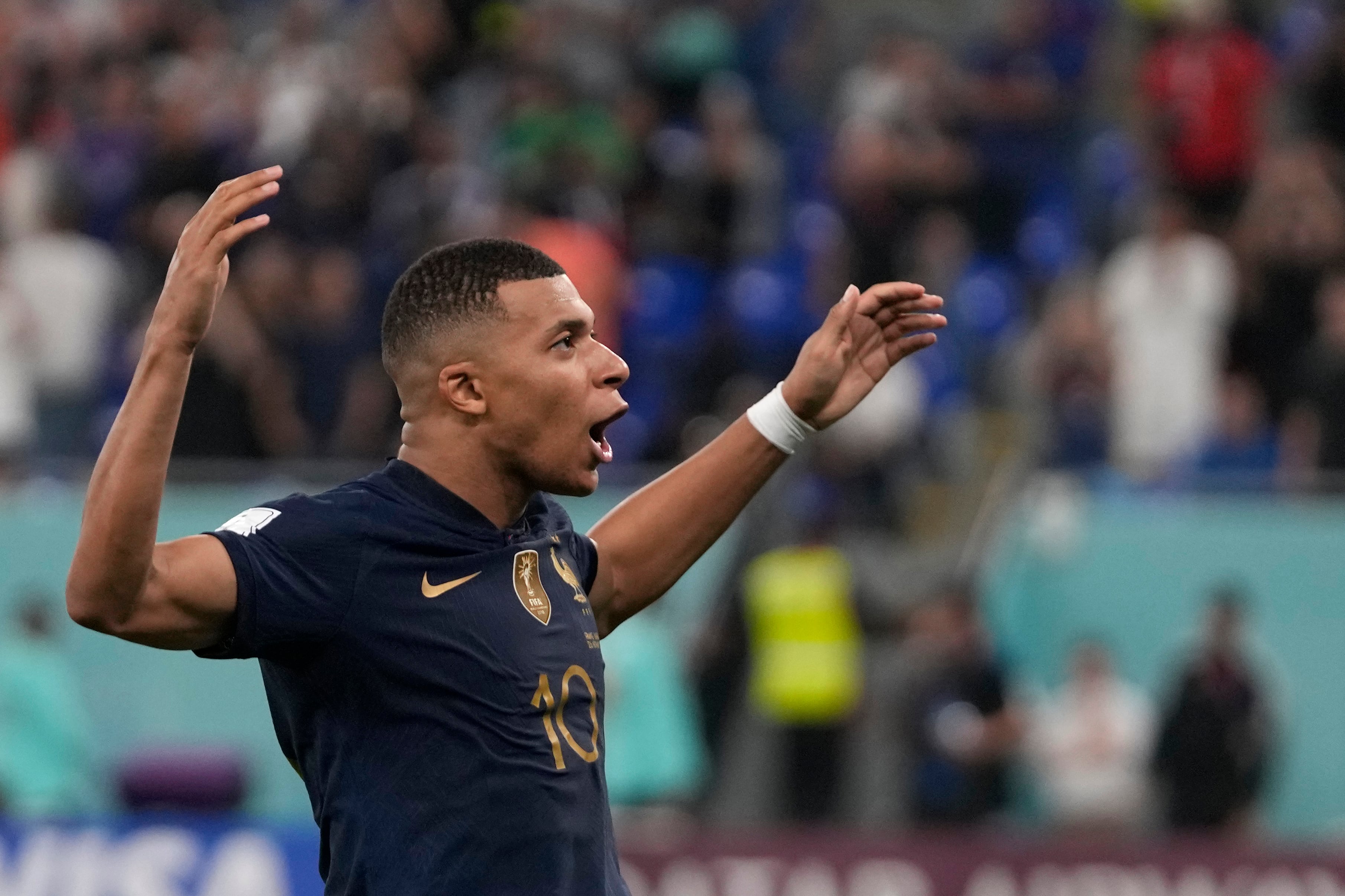 France's Kylian Mbappe celebrates after scoring his sides second goal during the World Cup group D soccer match between France and Denmark, at the Stadium 974 in Doha, Qatar, Saturday, Nov. 26, 2022. (AP Photo/Thanassis Stavrakis)