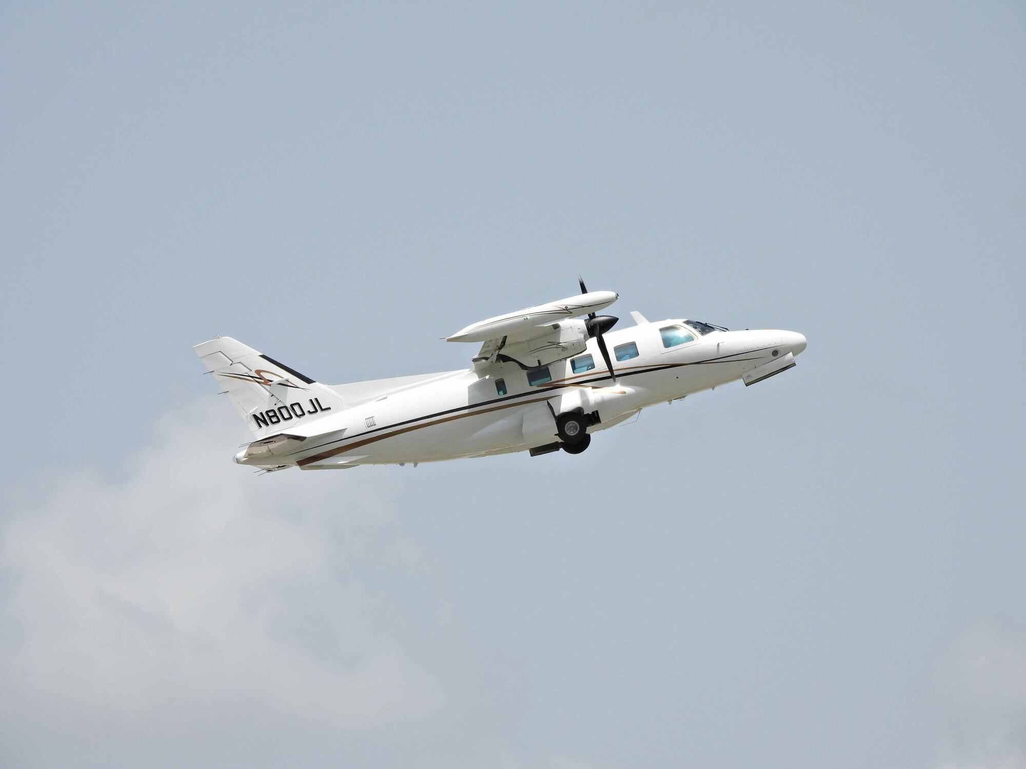 Boca Raton, Palm Beach County, Florida, USA July 27, 2022. A Mitsubishi MU-2B-60,
fixed wing multi engine, 10 seats / 2 engines, (twin-turboprop), N800JL, taking off from the Boca Raton Airport.
