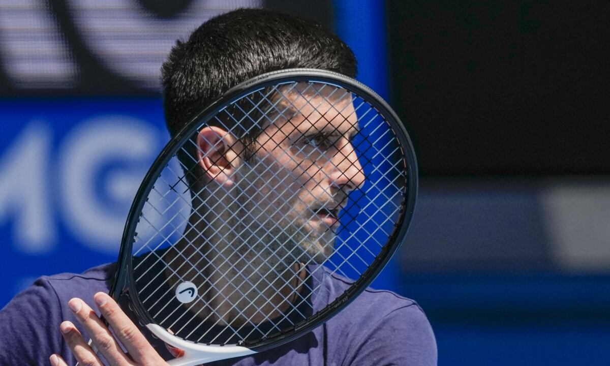 Defending champion Serbia's Novak Djokovic practices ahead of the Australian Open tennis championship in Melbourne, Australia, Jan. 12, 2022. Weary after two years of some of the harshest COVID-19 border restrictions in the world, many Australians wanted Djokovic kicked out of their country for traveling to the tennis tournament without being vaccinated. But the backdrop to the government's tough line on the defending Australian Open champion and Prime Minister Scott Morrison’s description of the expulsion as a "decision to keep our borders strong" dates to nearly a decade ago. It also shines a light on Australia's complicated, and strongly criticized, immigration and border policies. (AP/Mark Baker, File)