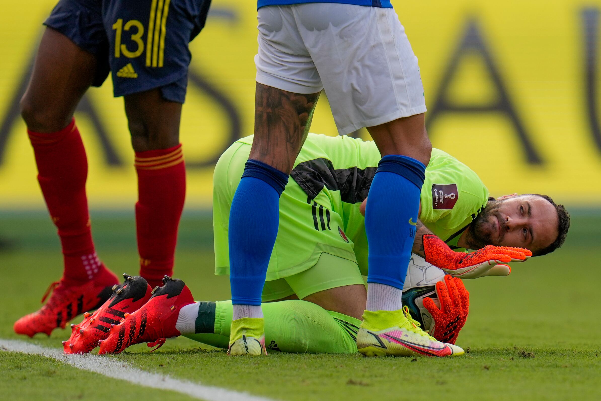 Colombia's goalkeeper David Ospina makes a save during a qualifying soccer match for the FIFA World Cup Qatar 2022 against Brazil in Barranquilla, Colombia, Sunday, Oct. 10, 2021. (AP Photo/Fernando Vergara)