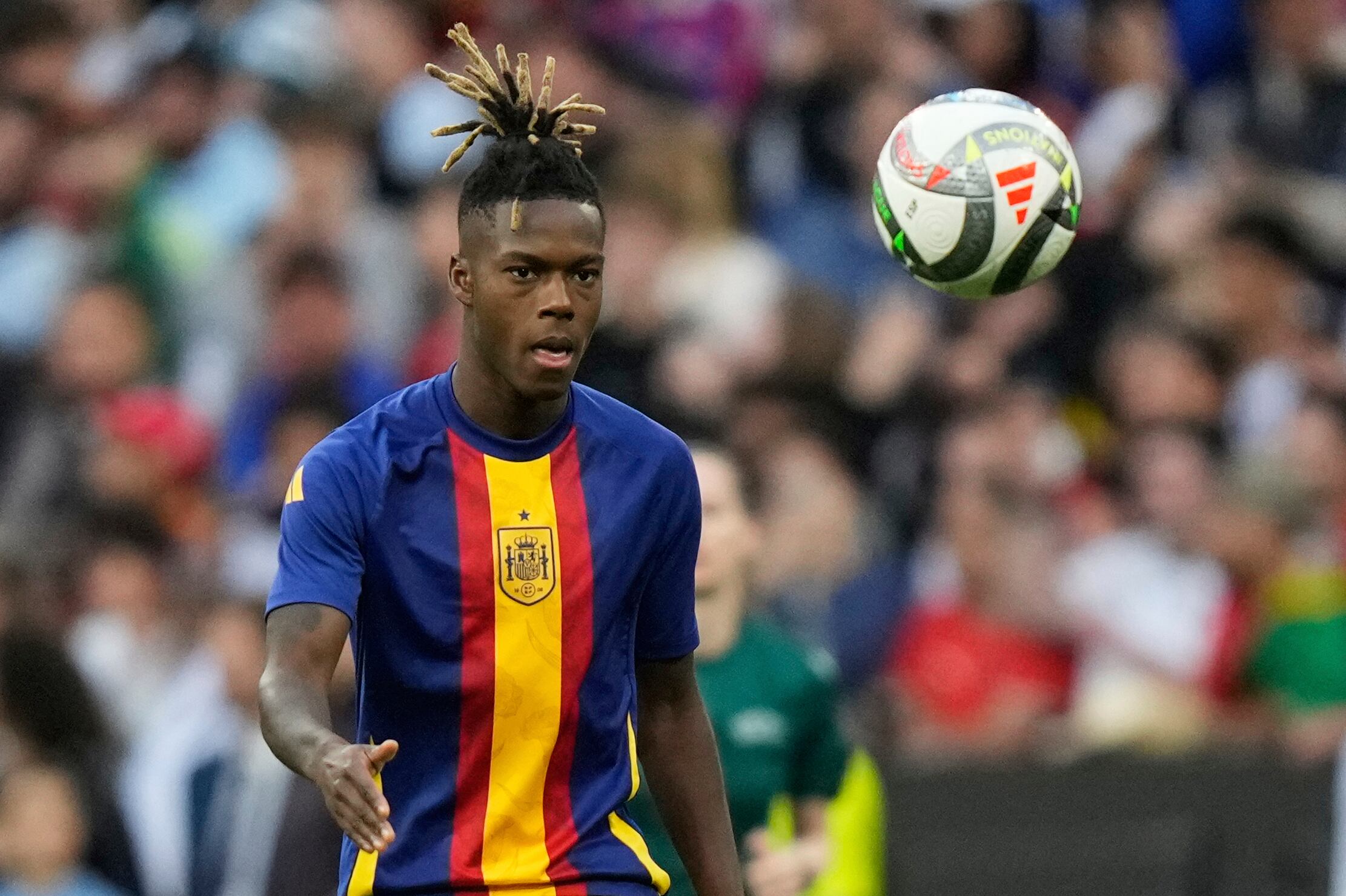 Spain's Nico Williams eyes the ball prior the start of the Nations League final soccer match between Portugal and Spain at the Allianz Arena in Munich, Germany, Sunday, June 8, 2025. (AP Photo/Matthias Schrader)