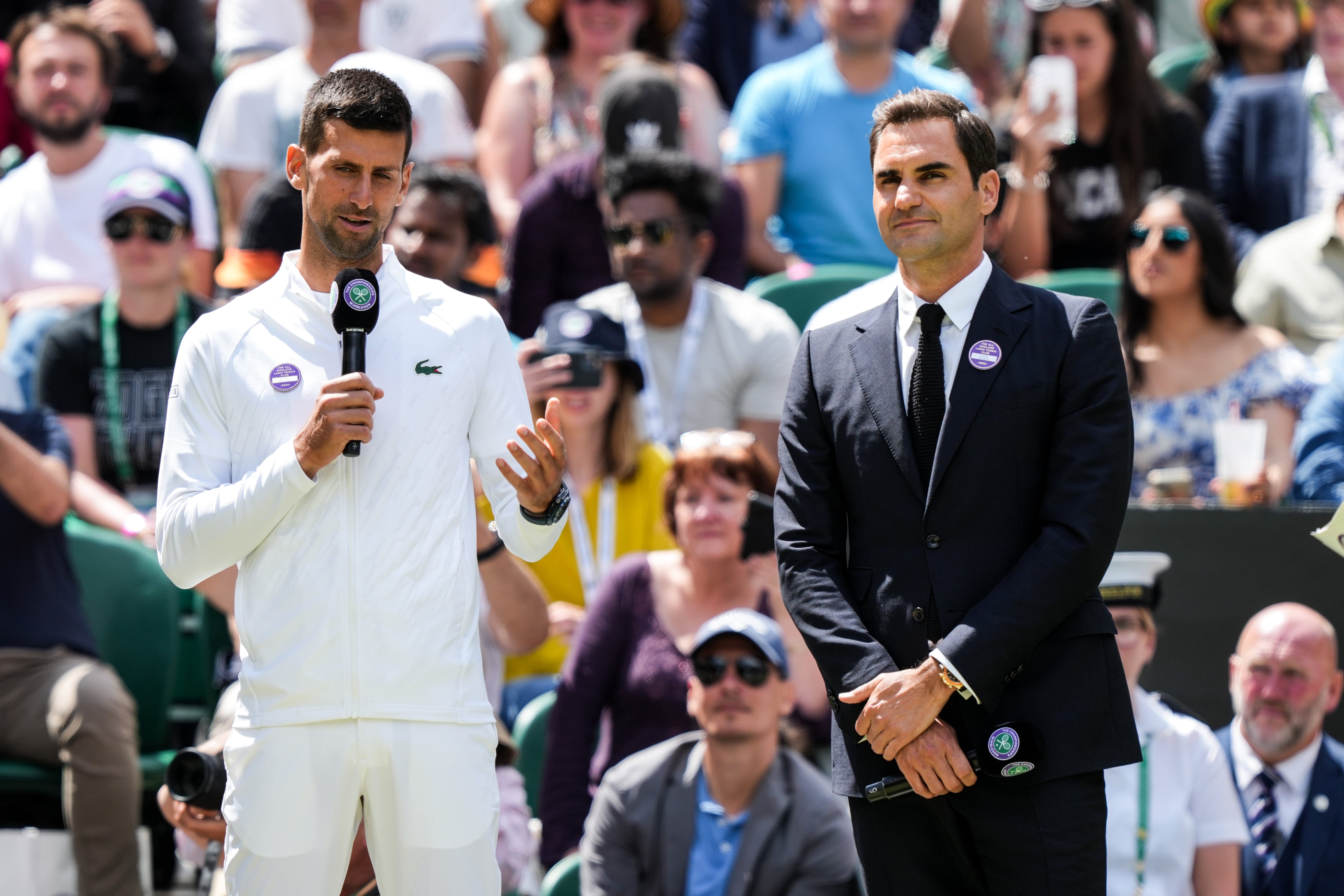 LONDON, ENGLAND - JULY 03: Novak Djokovic (L) of Serbia and Roger Federer of Switzerland attend the Centre Court Centenary Celebration during day seven of The Championships Wimbledon 2022 at All England Lawn Tennis and Croquet Club on July 03, 2022 in London, England. (Photo by Shi Tang/Getty Images)