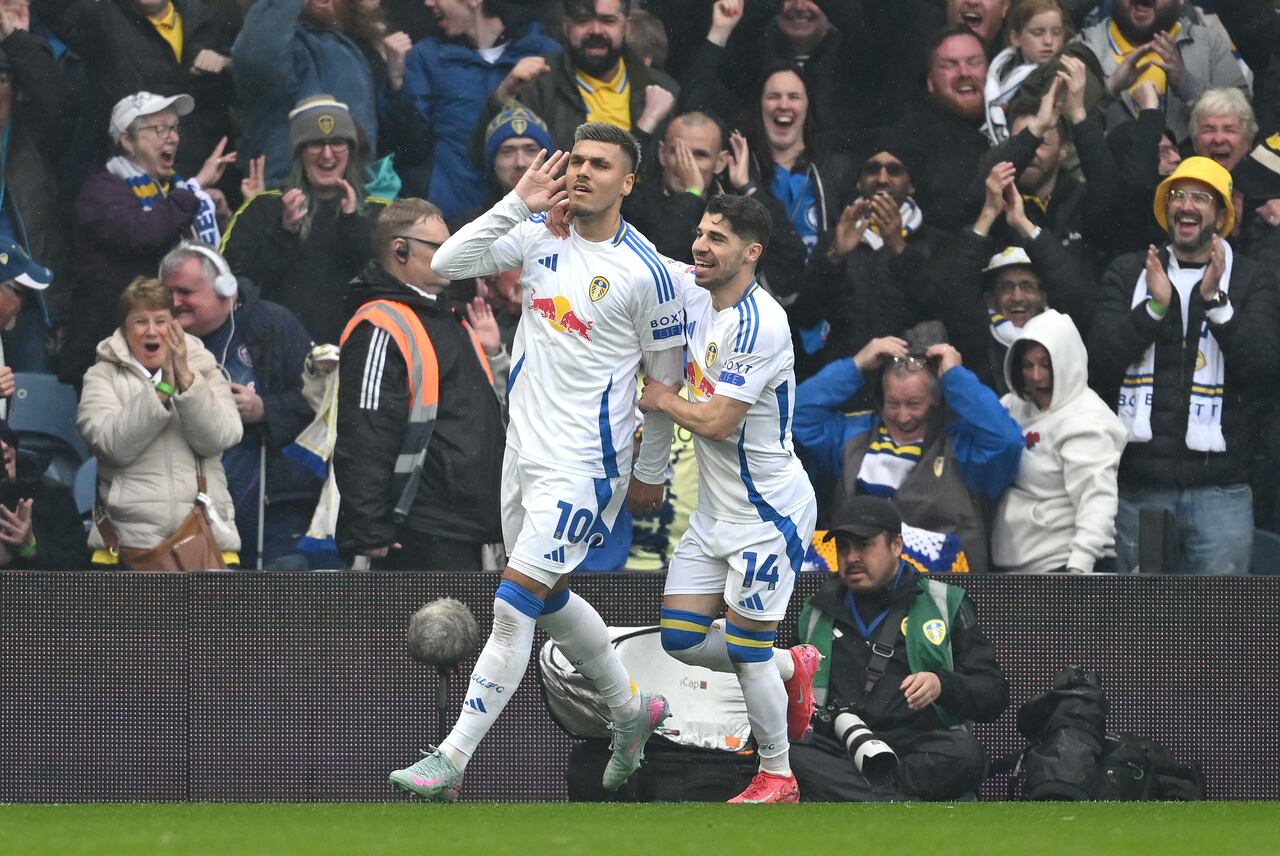 LEEDS, ENGLAND - APRIL 21: Joel Piroe of Leeds United celebrates with teammate Manor Solomon after scoring his team's third goal to complete his hat-trick during the Sky Bet Championship match between Leeds United FC and Stoke City FC at Elland Road on April 21, 2025 in Leeds, England. (Photo by Michael Regan/Getty Images) (Photo by MICHAEL REGAN / GETTY IMAGES EUROPE / Getty Images via AFP)