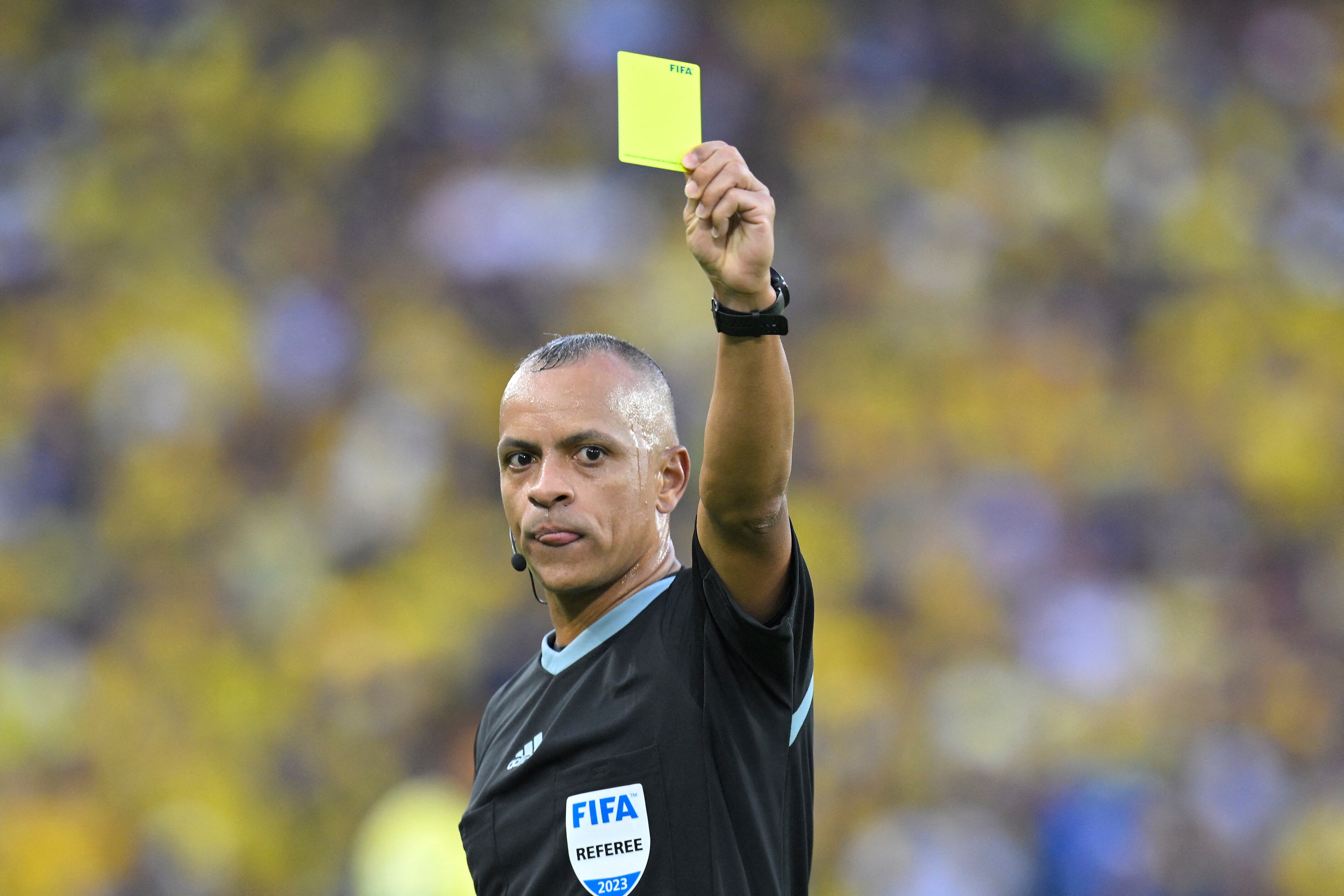 Brazilian referee Wilton Pereira Sampaio shows a yellow card during the 2026 FIFA World Cup South American qualifiers football match between Ecuador and Uruguay, at the Rodrigo Paz Delgado stadium in Quito, on September 12, 2023. (Photo by Rodrigo BUENDIA / AFP)