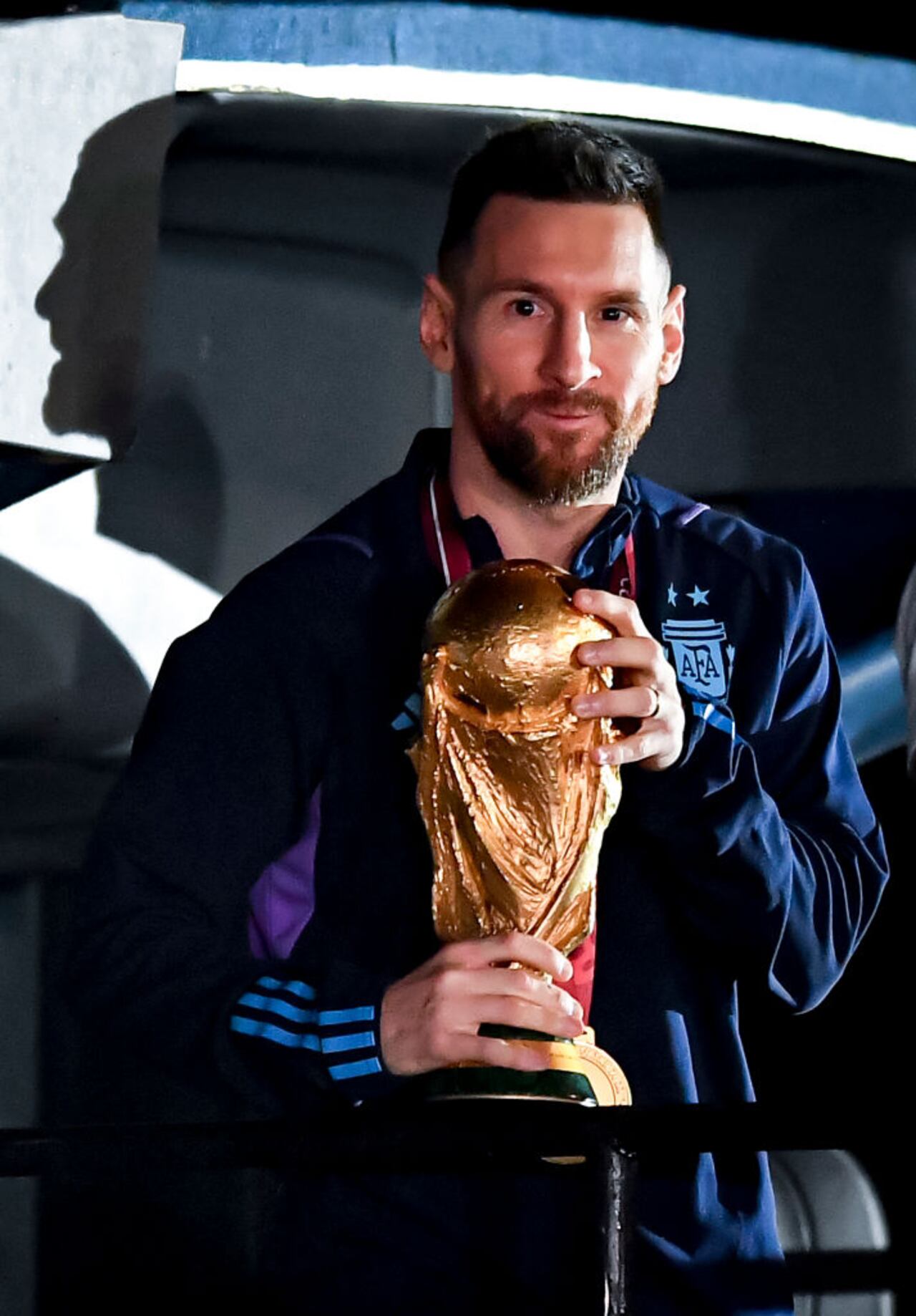 BUENOS AIRES, ARGENTINA - DECEMBER 20: Lionel Messi holds the FIFA World Cup during the arrival of the Argentina men's national football team after winning the FIFA World Cup Qatar 2022 on December 20, 2022 in Buenos Aires, Argentina. (Photo by Marcelo Endelli/Getty Images)