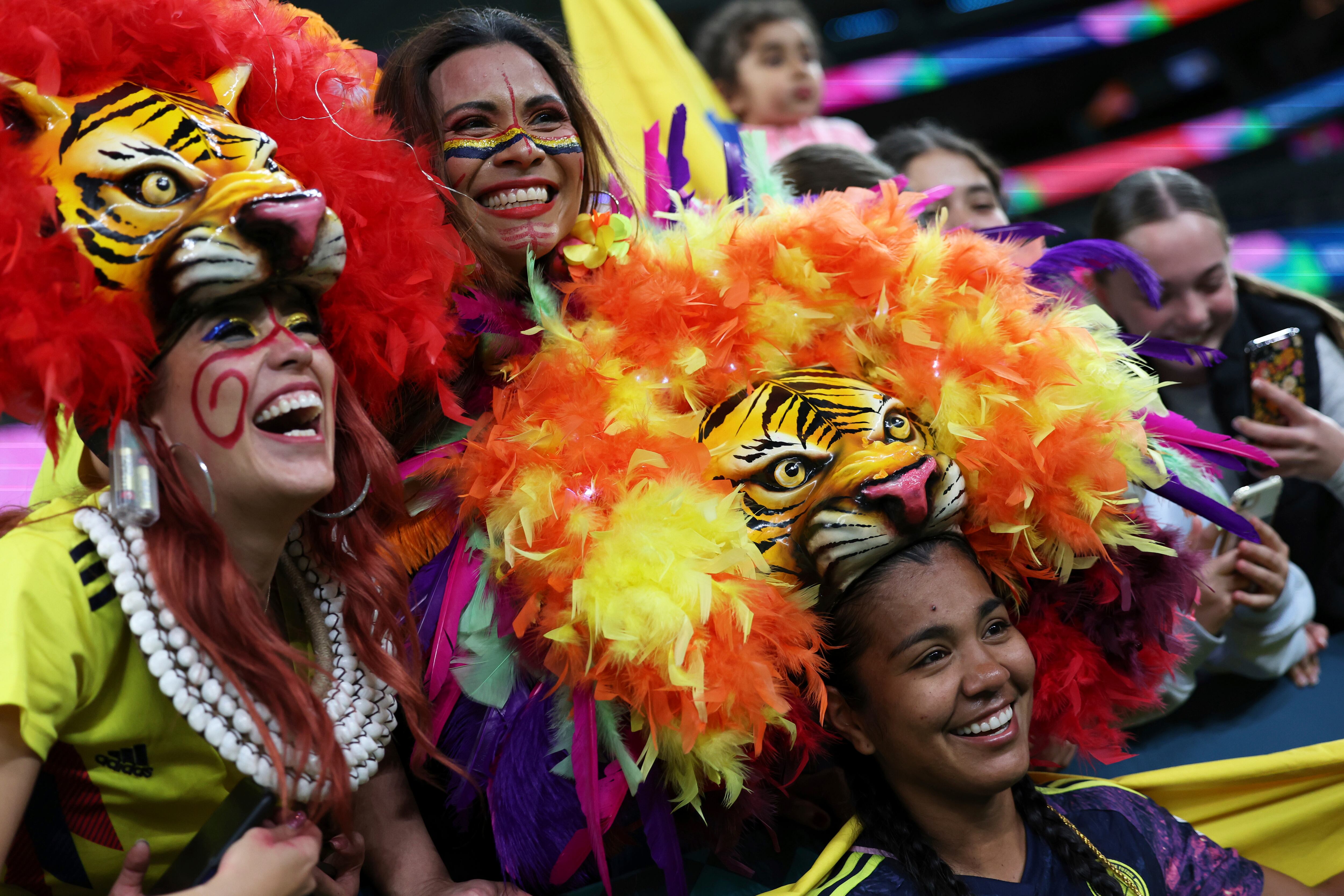 Colombia's Daniela Arias dons a mask from fans and poses for photos at the end of the Women's World Cup Group H soccer match between Germany and Colombia at Sydney Football Stadium in Sydney, Australia, Sunday, July 30, 2023. Colombia won 2-1. (AP Photo/Jessica Gratigny)