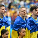Ukraine's players line up prior to the UEFA Euro 2024 Group E football match between Romania and Ukraine at the Munich Football Arena in Munich on June 17, 2024. (Photo by Miguel MEDINA / AFP)