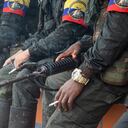 FARC-EP Guerrilla members hold firearms during the announcement by the FARC's Central General Staff (EMC) to open peace talks with the Colombian government during an assembly in San Vicente del Caguan, Colombia on April 16, 2023. (Photo by: Sebastian Marmolejo/Long Visual Press/Universal Images Group via Getty Images)