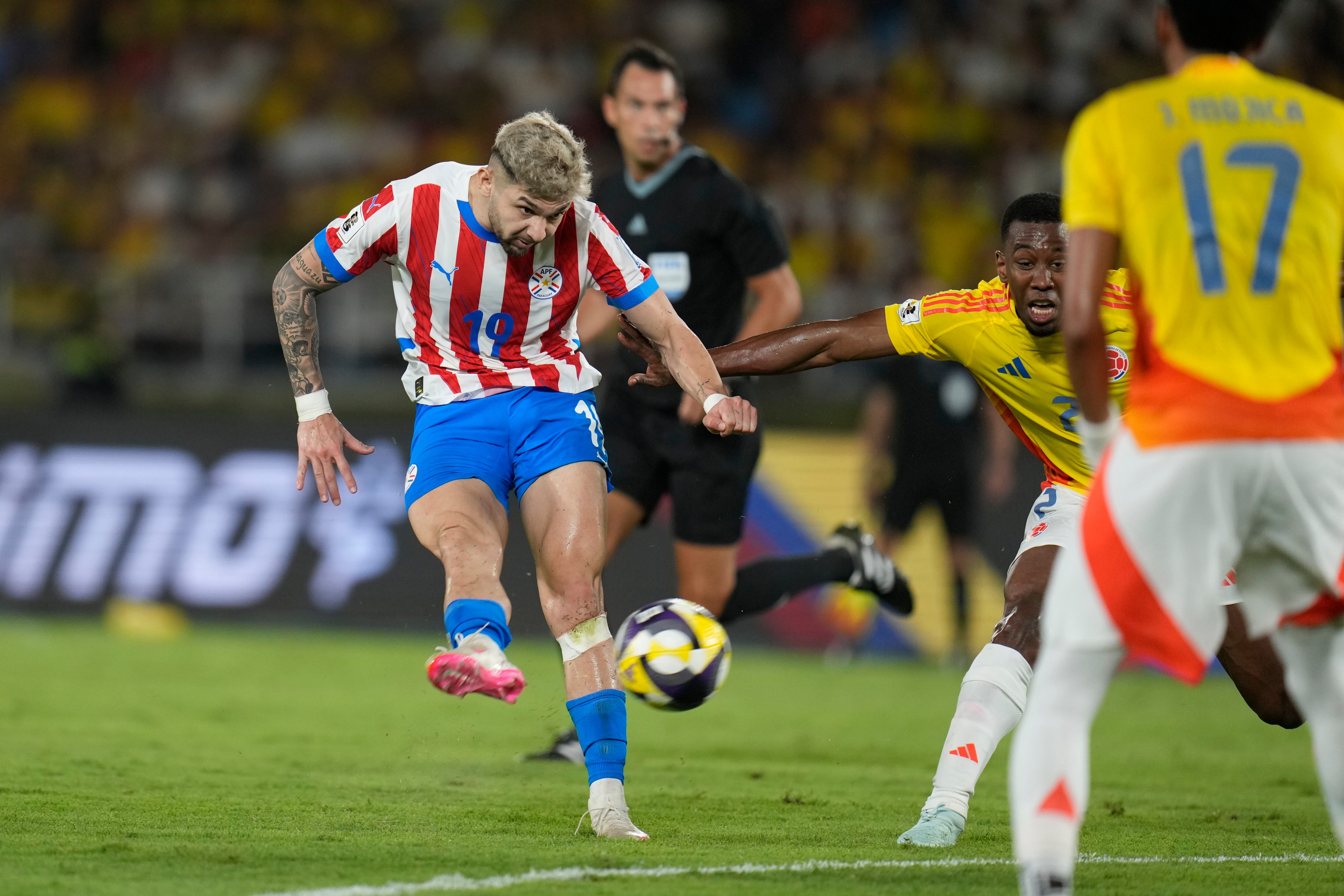 Paraguay's Julio Enciso scores his side's second goal against Colombia during a World Cup 2026 qualifying soccer match at Metropolitano Stadium in Barranquilla, Colombia, Tuesday, March 25, 2025. (AP Photo/Fernando Vergara)