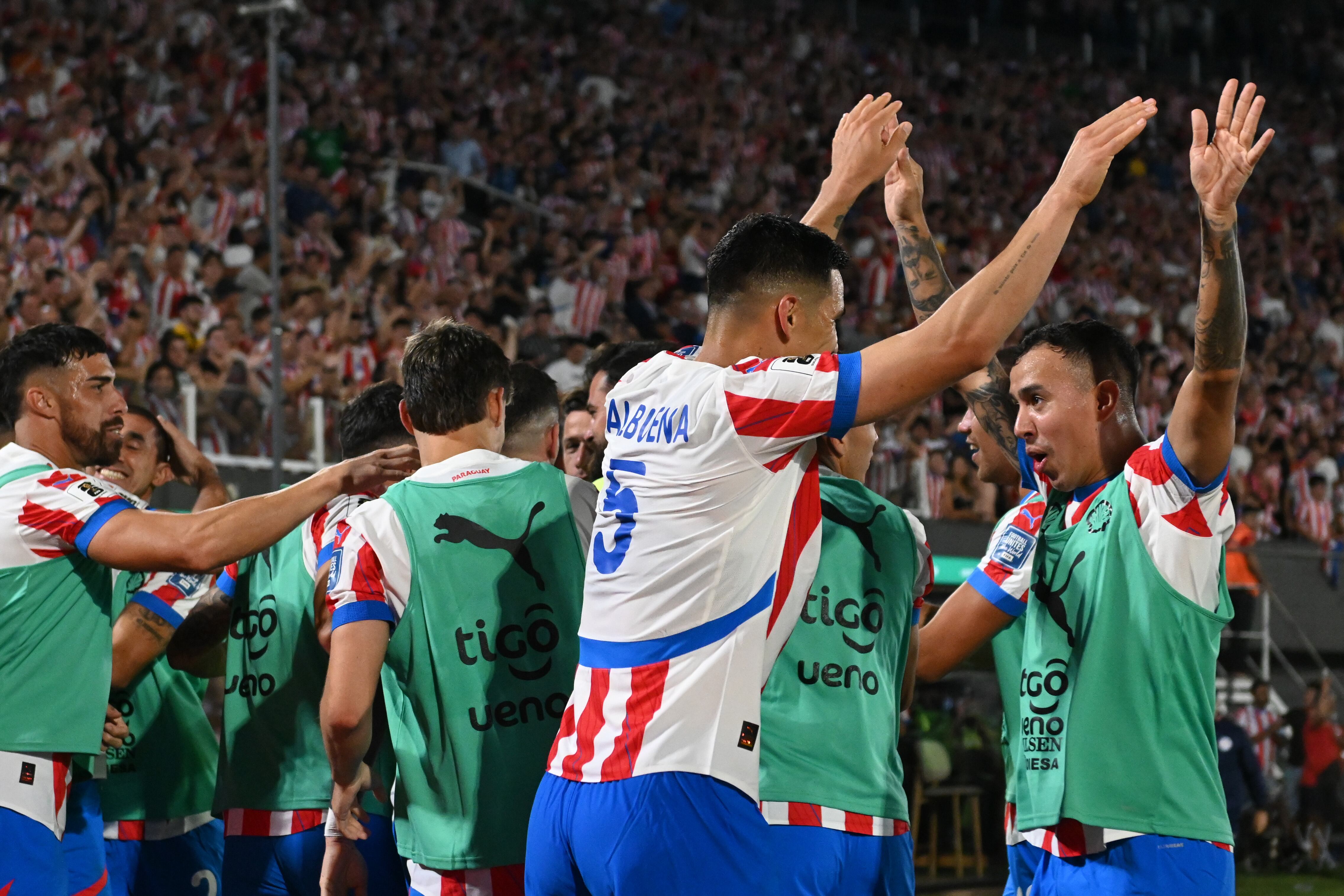ASUNCION, PARAGUAY - MARCH 20: Omar Alderete of Paraguay (hidden) celebrates with teammates after scoring the team's first goal during the South American FIFA World Cup 2026 Qualifier match between Paraguay and Chile at Estadio Defensores del Chaco on March 20, 2025 in Asuncion, Paraguay. (Photo by Christian Alvarenga/Getty Images)