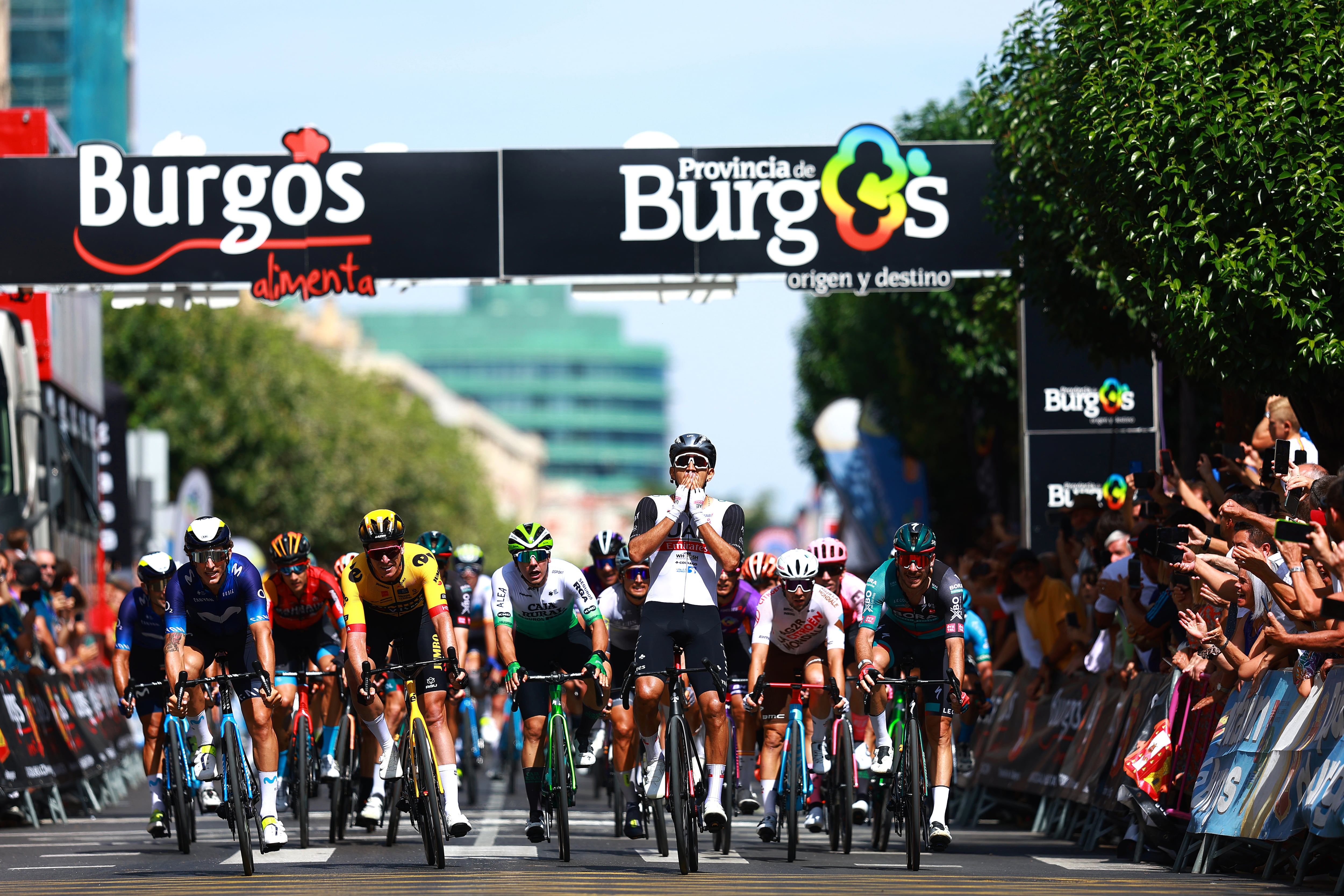 BURGOS, SPAIN - AUGUST 15: A general view of Juan Sebastian Molano Benavides of Colombia and UAE Team Emirates celebrates at finish line as stage winner ahead of Ivan Garcia Cortina of Spain and Movistar Team and Edoardo Affini of Italy and Team Jumbo-Visma during the 45th Vuelta a Burgos 2023, Stage 1 a 161km stage from Villalba de Duero to Burgos on August 15, 2023 in Burgos, Spain. (Photo by Gonzalo Arroyo Moreno/Getty Images)