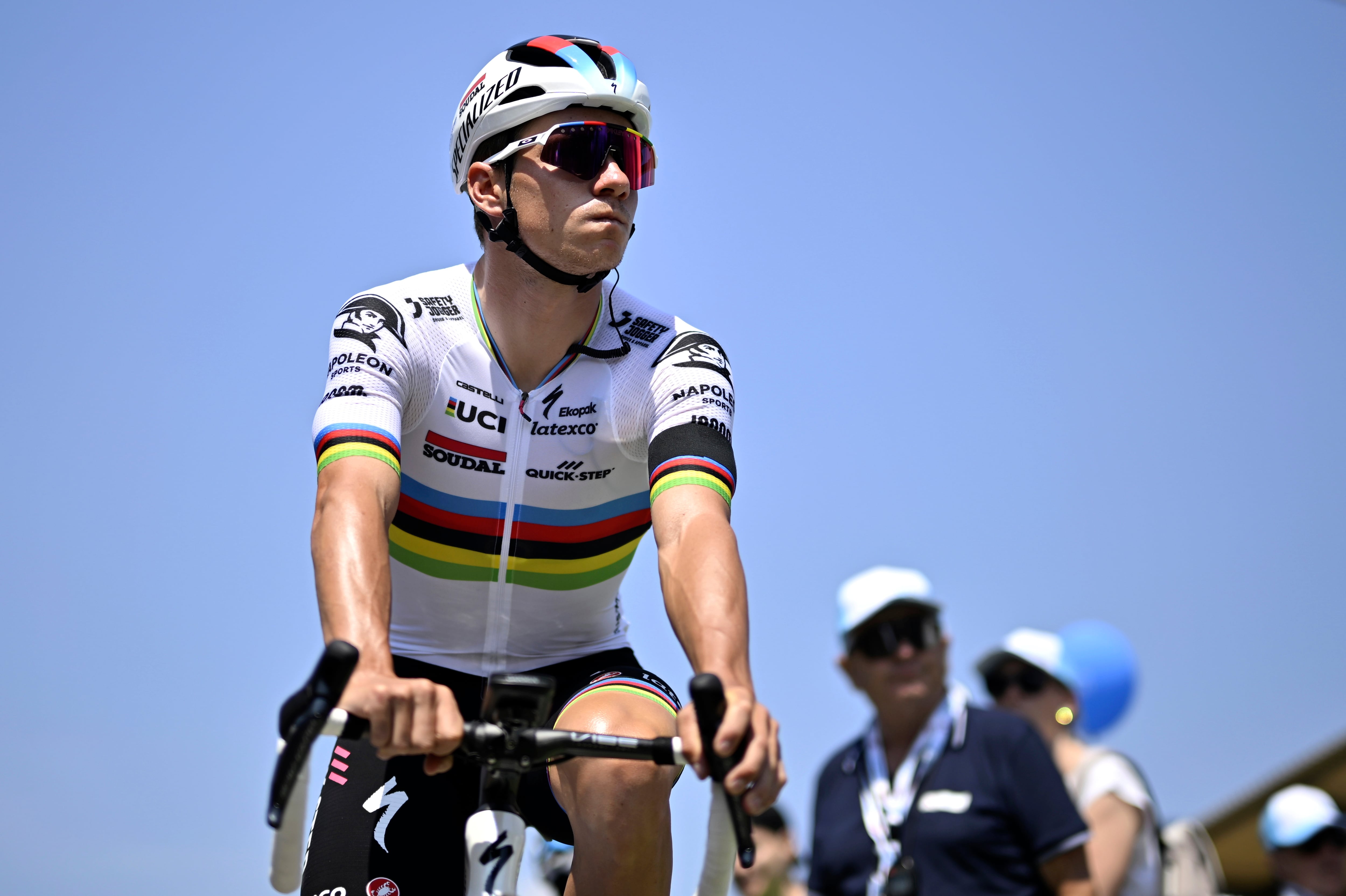 Belgium's Remco Evenepoel attends a memorial event for Switzerland's fatally injured rider Gino Maeder prior to the start of the the seventh stage, a 174 km race from Tuebach to Weinfelden, at the 86th Tour de Suisse cycling race, on Saturday, June 17, 2023, in Tuebach. Mäder died Friday, one day after crashing and falling down a ravine during a descent at the Tour de Suisse. (Gian Ehrenzeller/Keystone via AP)