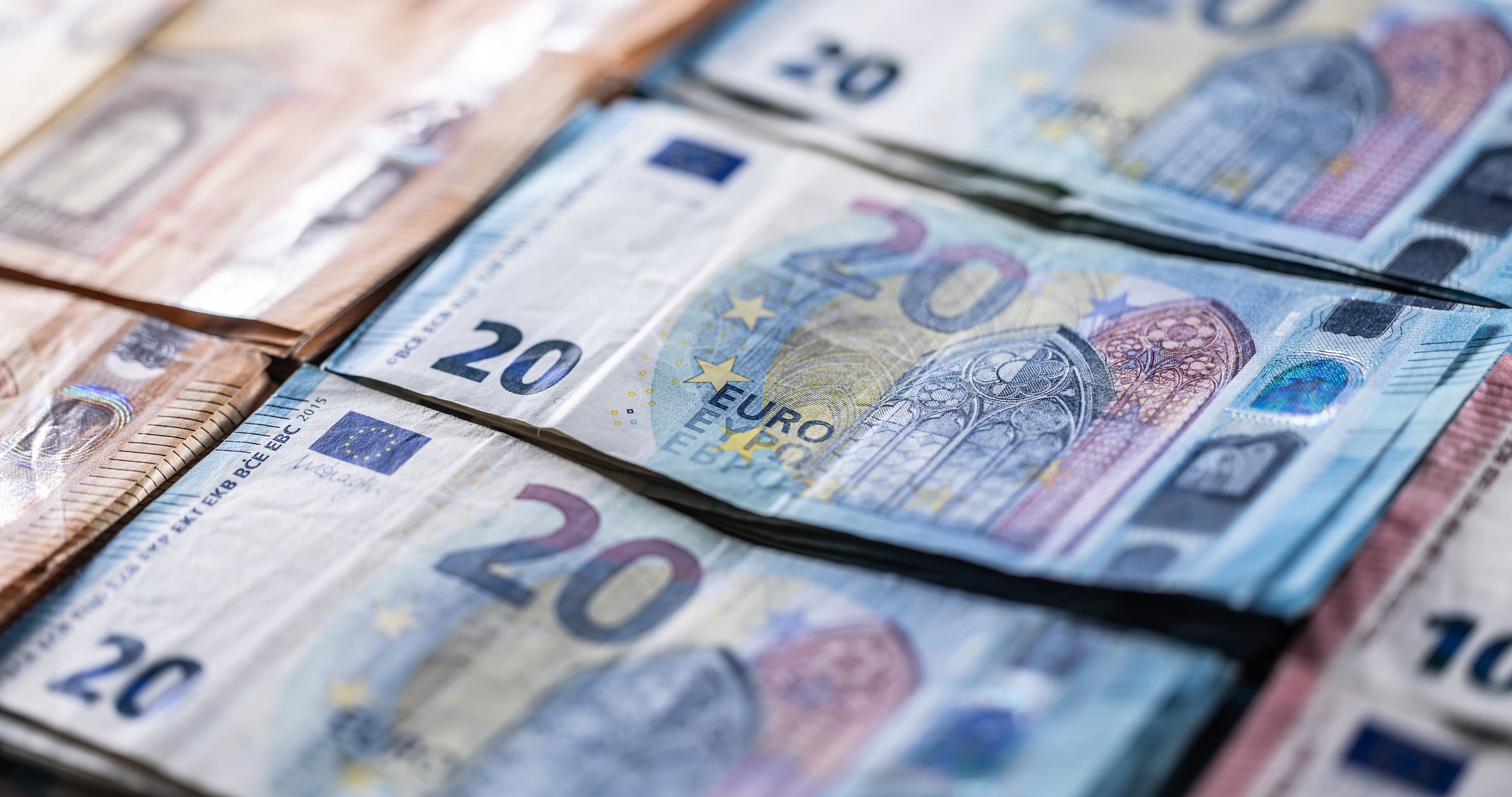 Euro currency. Banknotes stacked on each other in different positions.Several hundred euro banknotes stacked by value