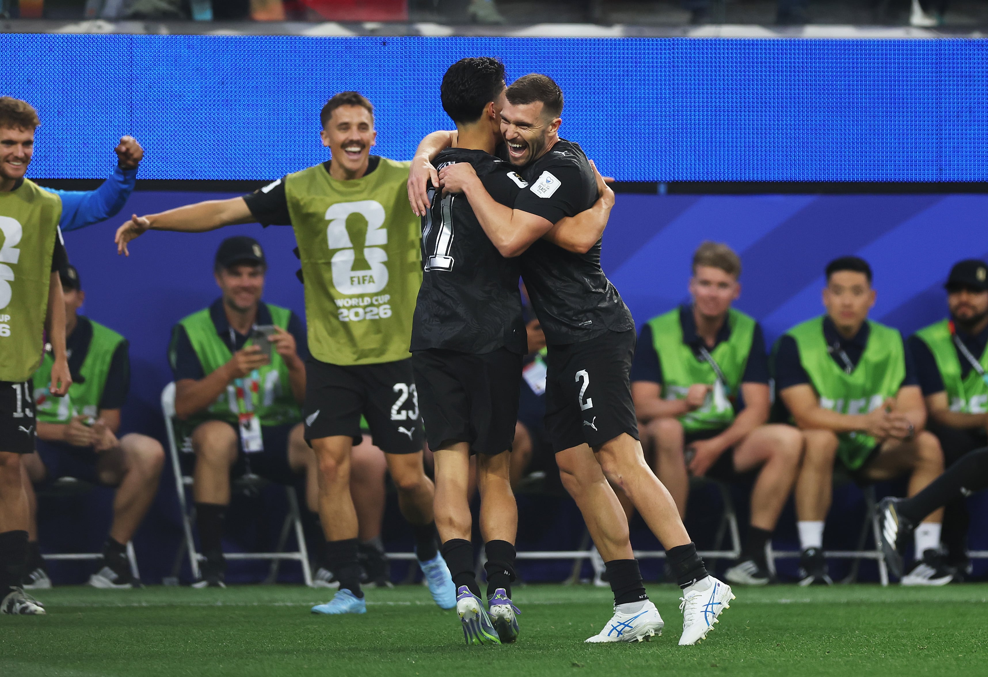 LOS ANGELES, CALIFORNIA - JUNE 15: Elijah Just #11 of New Zealand celebrates with teammate Tim Payne #2 after scoring his team's second goal during the FIFA World Cup 2026 Group G match between IR Iran and New Zealand at Los Angeles Stadium on June 15, 2026 in Los Angeles, California. (Photo by Jamie Squire/Getty Images)