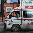An ambulance is seen near the the site of explosions in Mogadishu, on August 20, 2022. - Al-Shabaab fighters attacked the Hayat hotel in the Somali capital of Mogadishu on Friday, with casualties reported, security sources and witnesses said. (Photo by Hassan Ali ELMI / AFP)