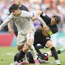 Spain's Alvaro Morata, centre, is held by Croatia's Luka Modric during the Euro 2020 soccer championship round of 16 match between Croatia and Spain at the Parken Stadium in Copenhagen, Monday June 28, 2021. (Stuart Franklin, Pool Photo via AP)