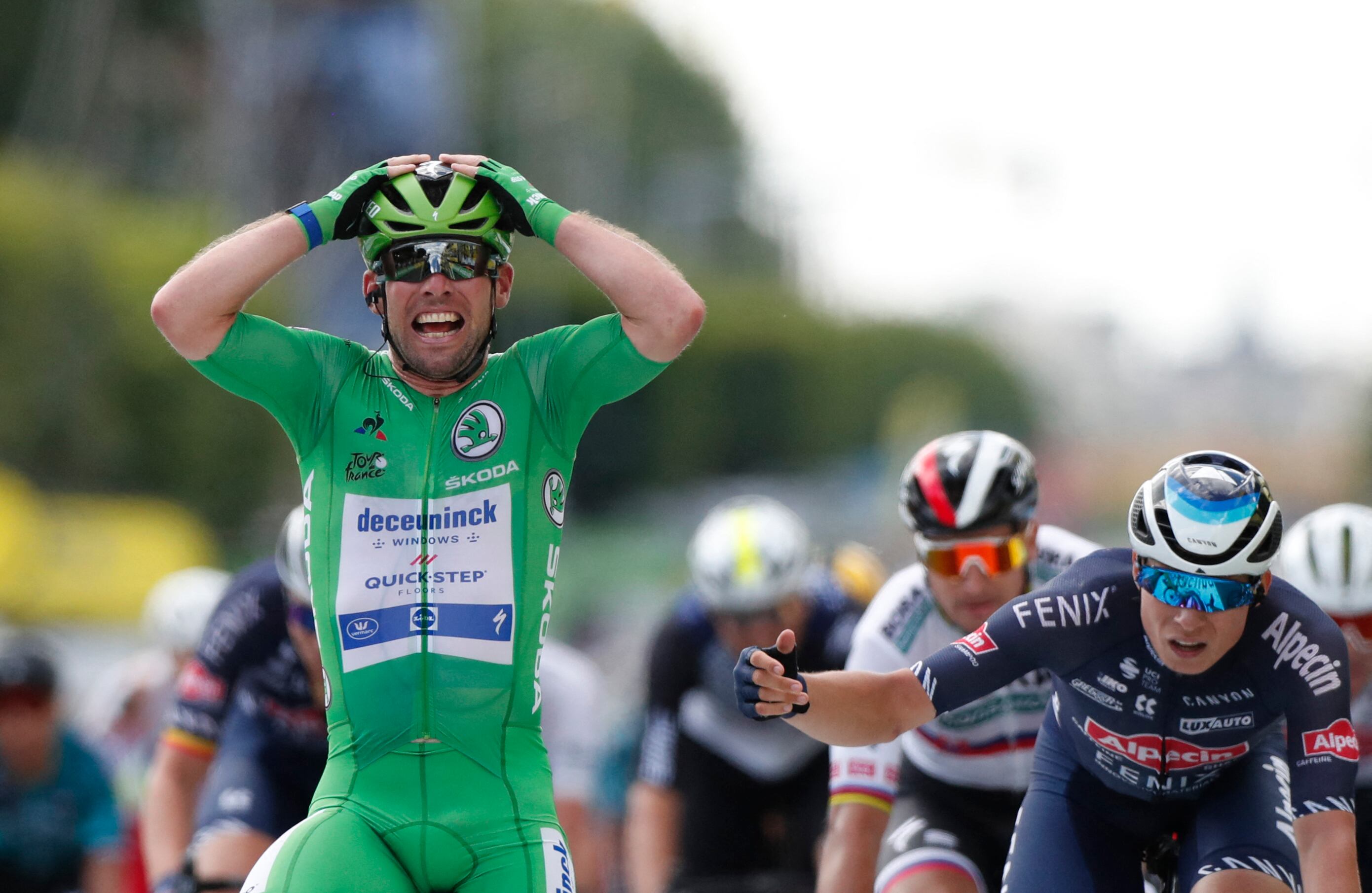 Team Deceuninck Quickstep's Mark Cavendish of Great Britain celebrates as he crosses the finish line of the 6th stage of the 108th edition of the Tour de France cycling race, 160 km between Tours and Chateauroux, on July 01, 2021. (Photo by Guillaume Horcajuelo / POOL / AFP)