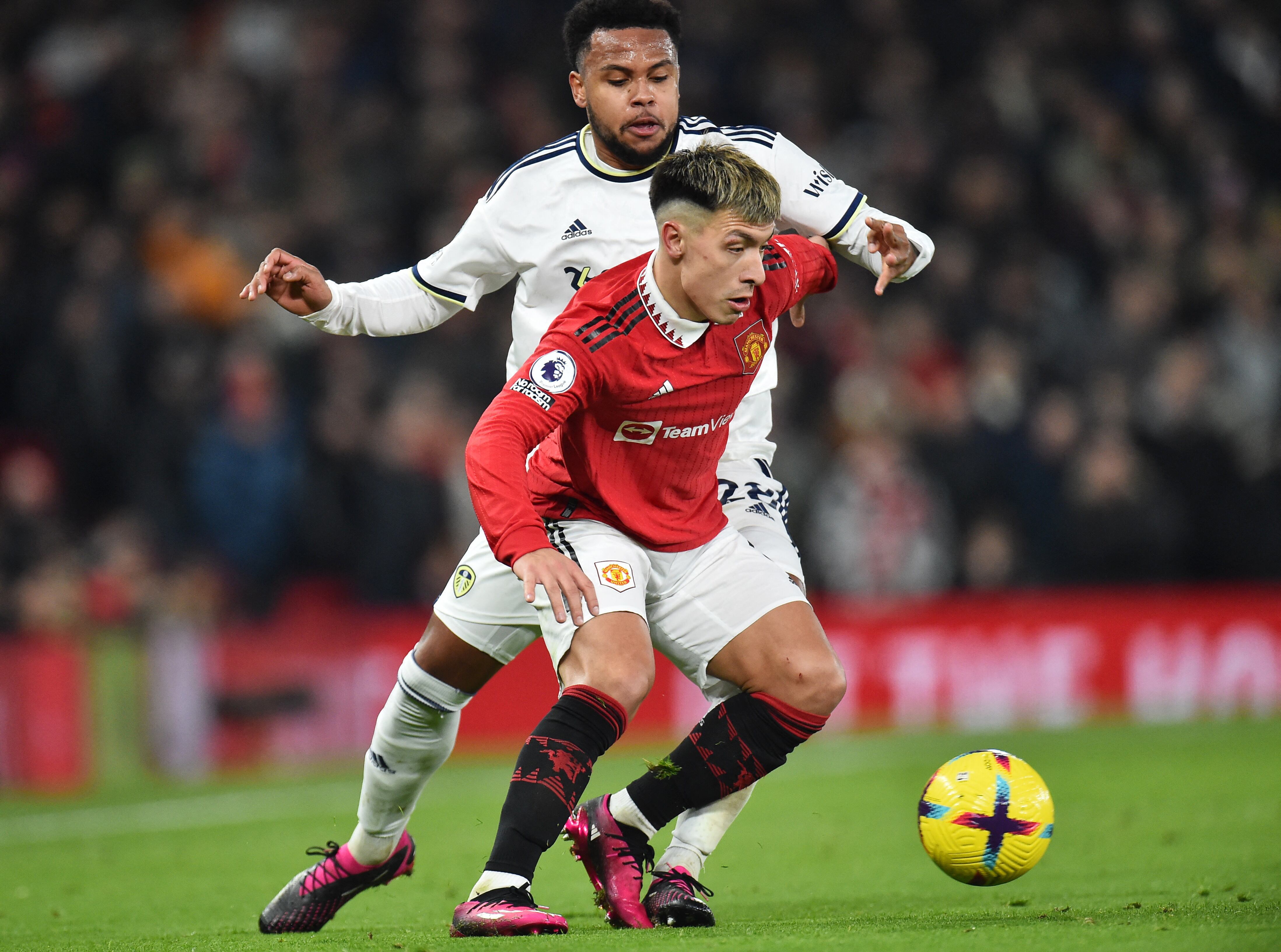 Soccer Football - Premier League - Manchester United v Leeds United - Old Trafford, Manchester, Britain - February 8, 2023 Leeds United's Weston McKennie in action with Manchester United's Lisandro Martinez REUTERS/Peter Powell EDITORIAL USE ONLY. No use with unauthorized audio, video, data, fixture lists, club/league logos or 'live' services. Online in-match use limited to 75 images, no video emulation. No use in betting, games or single club /league/player publications.  Please contact your account representative for further details.