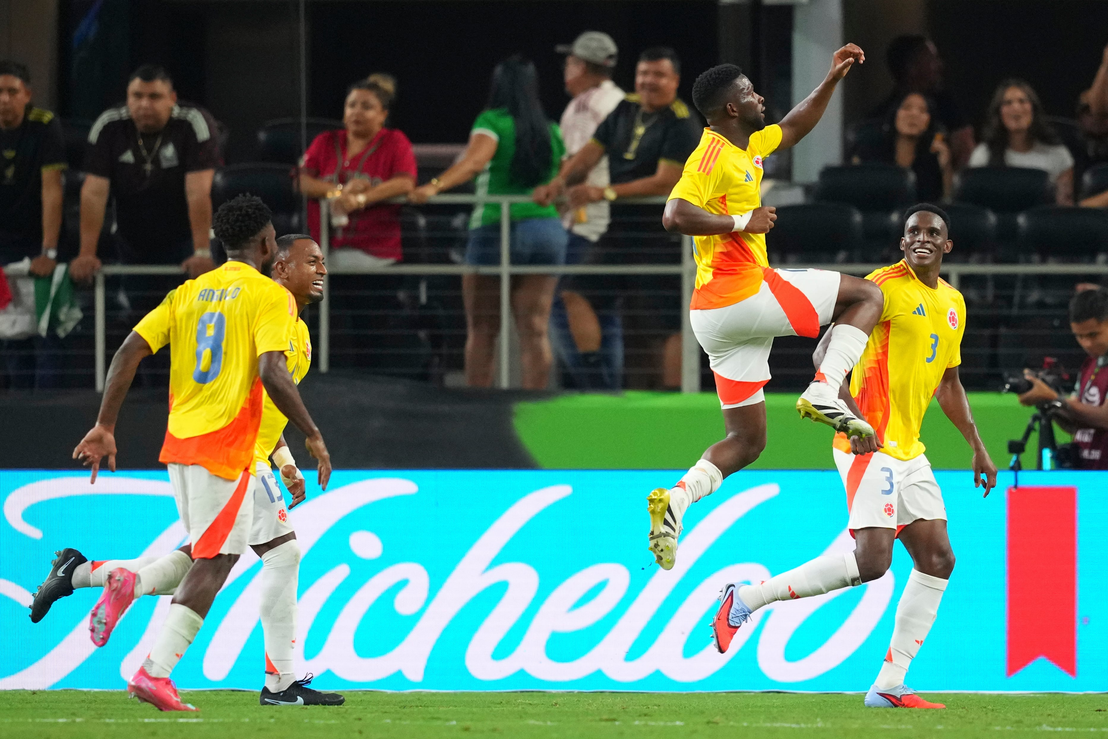 Colombia's Jefferson Lerma, center, reacts after scoring a goal on Mexico during the second half of an international soccer friendly match Saturday, Oct. 11, 2025, in Arlington, Texas. (AP Photo/Julio Cortez)