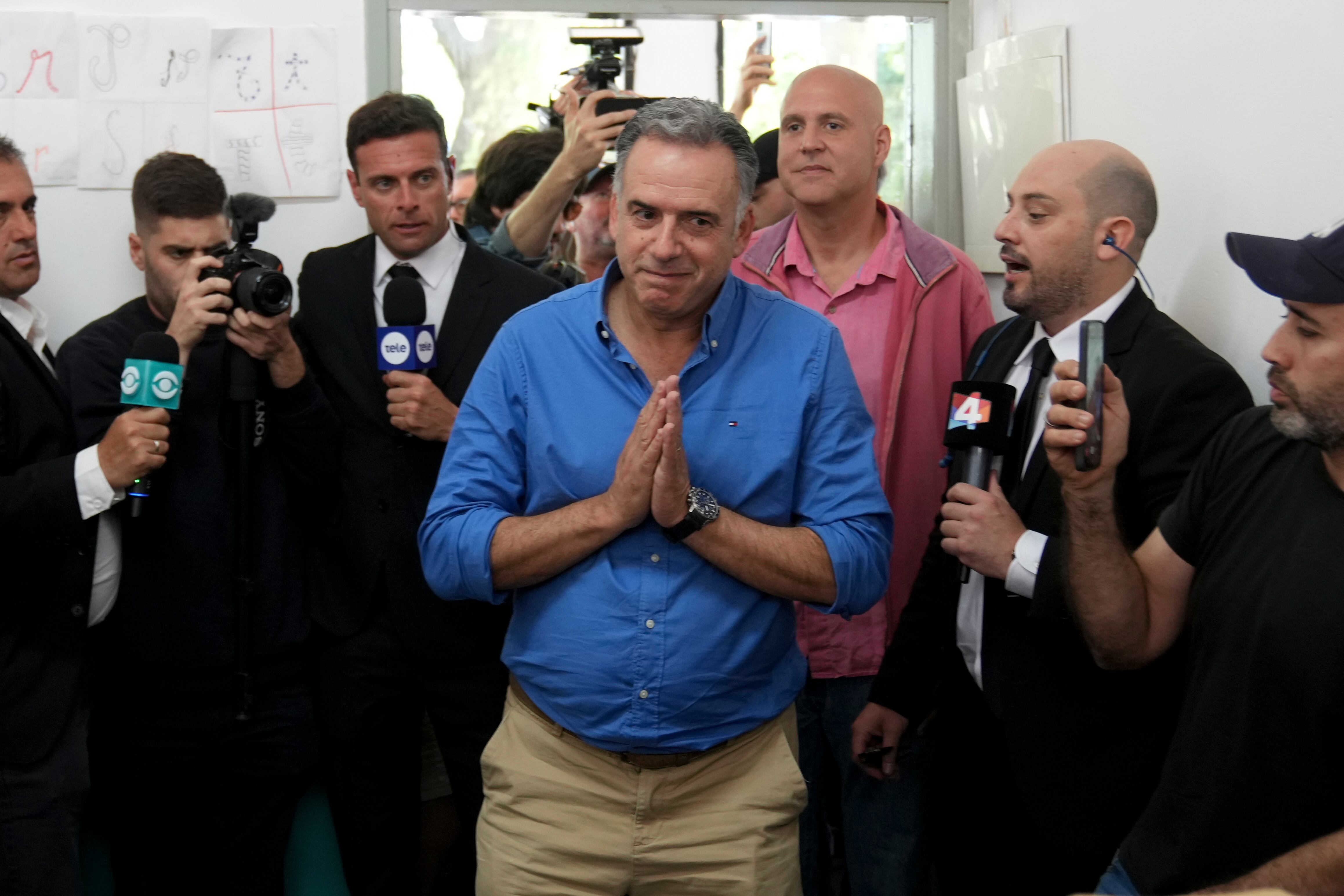 Frente Amplio presidential candidate Yamandu Orsi arrives to vote at a polling station during general elections in Canelones, Uruguay, Sunday, Oct. 27, 2024. (AP Photo/Matilde Campodonico)
