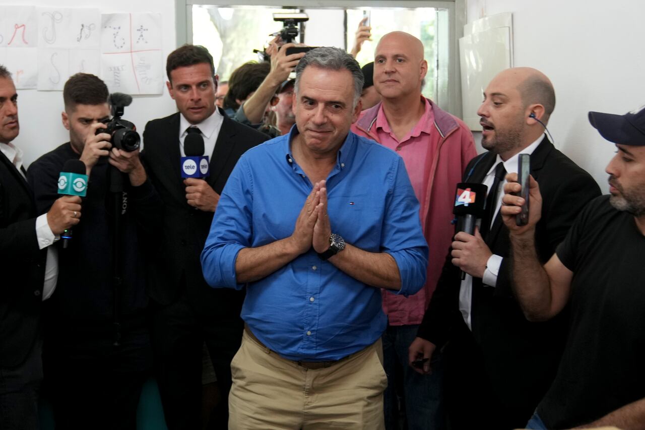 Frente Amplio presidential candidate Yamandu Orsi arrives to vote at a polling station during general elections in Canelones, Uruguay, Sunday, Oct. 27, 2024. (AP Photo/Matilde Campodonico)