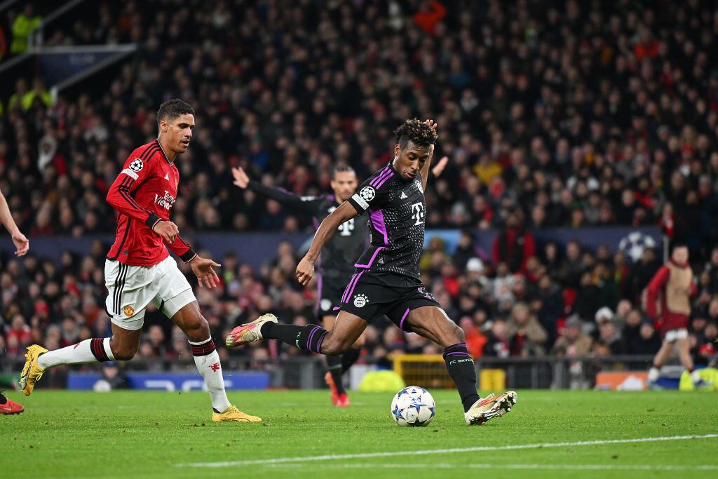 MANCHESTER, ENGLAND - DECEMBER 12: Kingsley Coman of Bayern Munich scores their team's first goal during the UEFA Champions League match between Manchester United and FC Bayern München at Old Trafford on December 12, 2023 in Manchester, England. (Photo by Shaun Botterill/Getty Images)