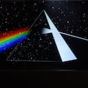 ATTENTION: EMBARGOED FOR PUBLICATION UNTIL 14 SEPTEMBER 14:30 GMT! - 13 September 2018, North Rhine-Westphalia, Dortmund: 13 September 2018, Germany, Dortmund: A woman stands in the so-called "Dortmunder U" in the exhibition The Pink Floyd Exhibition and looks at an animated projection of the prism from the flap cover of the album "The Dark Side of the Moon". The exhibition, conceived in London with members of the band, will only be shown in Dortmund within the German-speaking region. Photo: Bernd Thissen/dpa (Photo by Bernd Thissen/picture alliance via Getty Images)