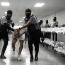 This handout picture released on March 16, 2025, by El Salvador's Presidency press office shows an alleged member of the Venezuelan criminal organization Tren de Aragua upon his arrival at the Terrorism Confinement Center (CECOT) in the city of Tecoluca, El Salvador. The United States has sent over 200 alleged members of a Venezuelan gang to be imprisoned in El Salvador, President Nayib Bukele said Sunday, after US counterpart Donald Trump invoked wartime authorities to expel migrants. (Photo by Handout / EL SALVADOR'S PRESIDENCY PRESS OFFICE / AFP) / RESTRICTED TO EDITORIAL USE - MANDATORY CREDIT "AFP PHOTO / EL SALVADOR'S PRESIDENCY PRESS OFFICE" - NO MARKETING NO ADVERTISING CAMPAIGNS - DISTRIBUTED AS A SERVICE TO CLIENTS