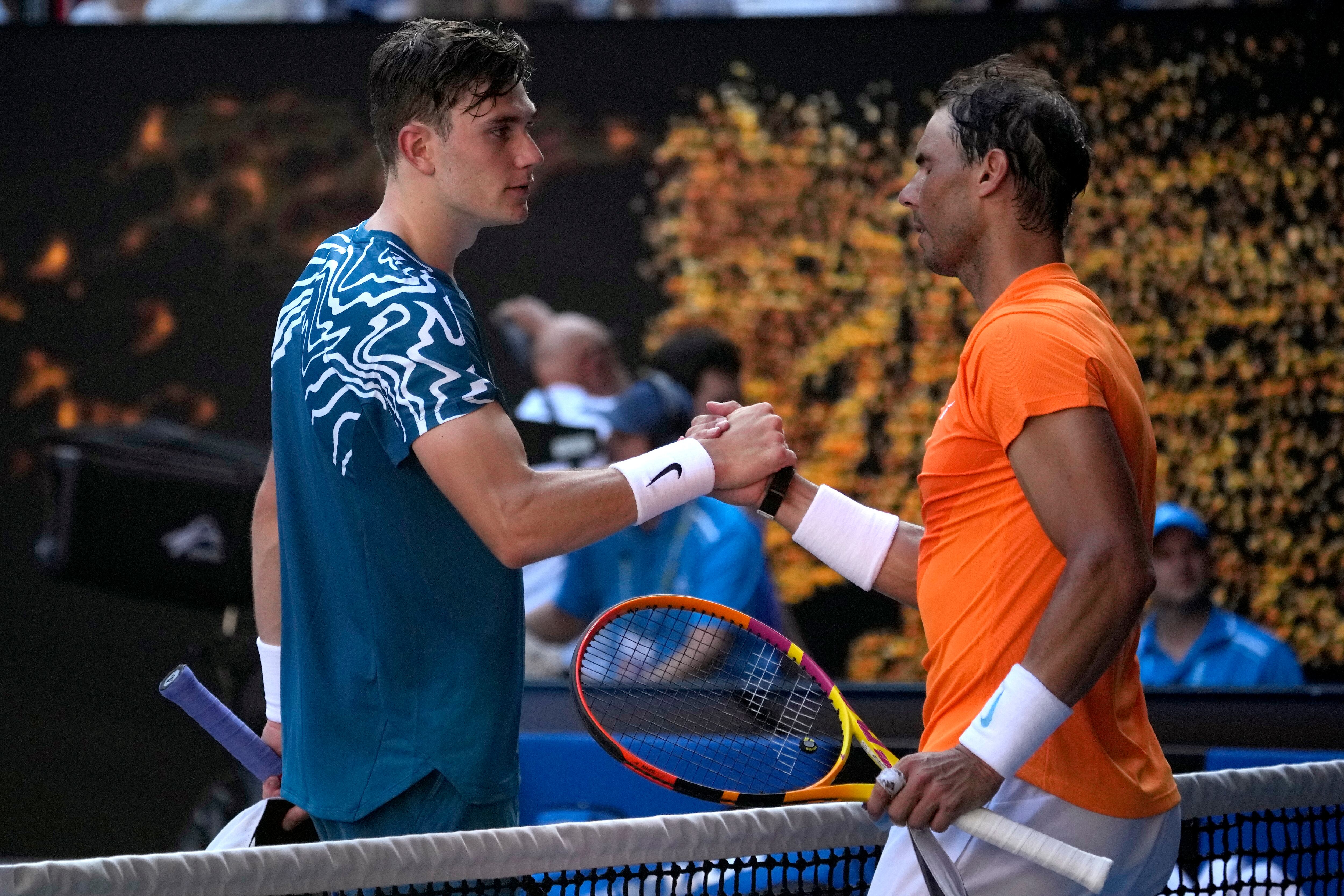 Rafael Nadal, right, of Spain is congratulated by Jack Draper of Britain following their first round match at the Australian Open tennis championship in Melbourne, Australia, Monday, Jan. 16, 2023. (AP Photo/Aaron Favila)