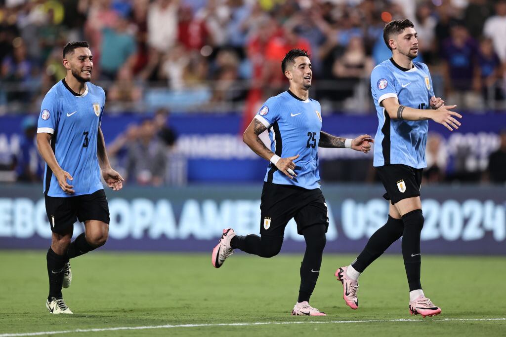 CHARLOTTE, NORTH CAROLINA - JULY 13: Federico Valverde of Uruguay and teammates celebrate after winning in the penalty shootout during the CONMEBOL Copa America 2024 third place match between Uruguay and Canada at Bank of America Stadium on July 13, 2024 in Charlotte, North Carolina. (Photo by Omar Vega/Getty Images)