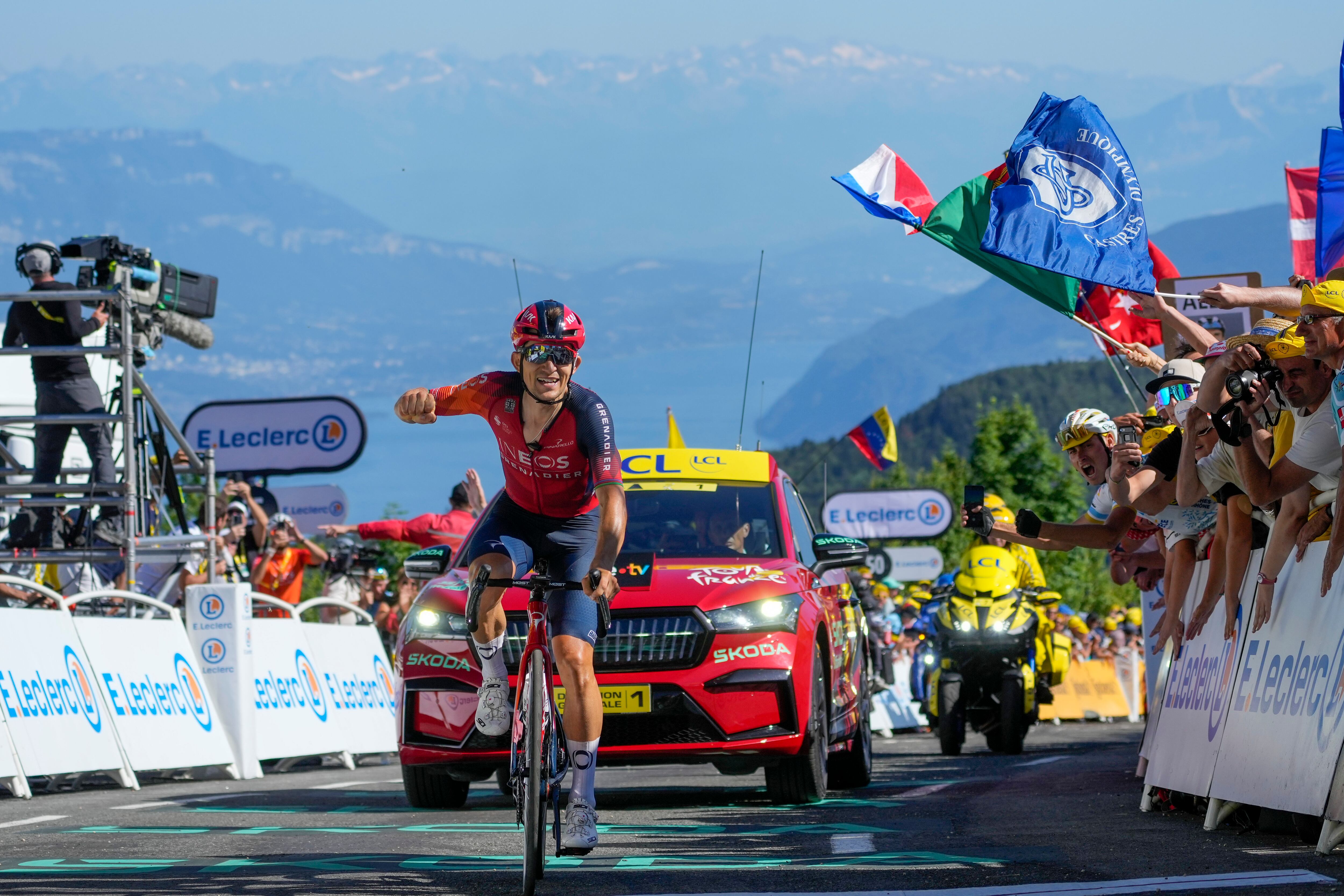 Poland's Michal Kwiatkowski crosses the finish line to win the thirteenth stage of the Tour de France cycling race over 138 kilometers (86 miles) with start in Chatillon-sur-Chalaronne and finish on Grand Colombier pass, France, Friday, July 14, 2023. (AP Photo/Thibault Camus)