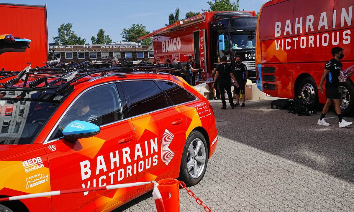 Bahrain Victorious staff outside their hotel in Glostrup, Denmark, Thursday, June 30, 2022. The Bahrain Victorious team at the Tour de France has been raided by police for the second time this week. Danish police searched the riders' hotel rooms in suburban Copenhagen on Thursday. (AP/Bo Amstrup/Ritzau Scanpix)