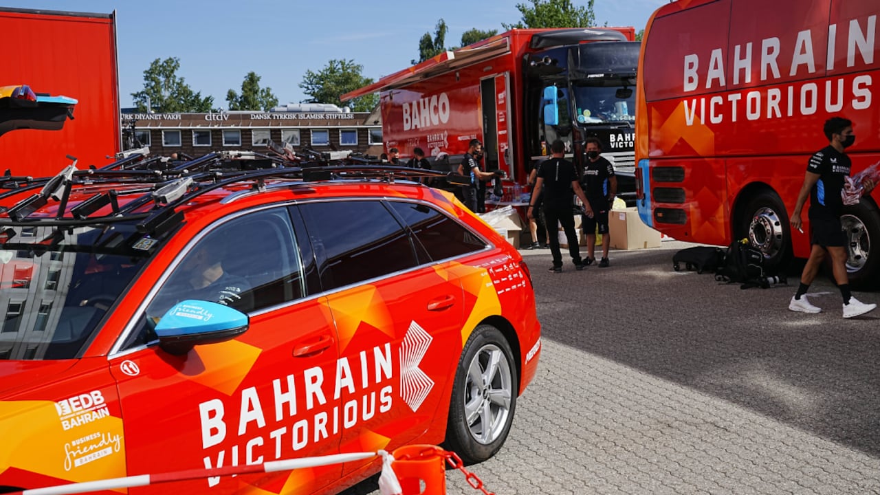 Bahrain Victorious staff outside their hotel in Glostrup, Denmark, Thursday, June 30, 2022. The Bahrain Victorious team at the Tour de France has been raided by police for the second time this week. Danish police searched the riders' hotel rooms in suburban Copenhagen on Thursday. (AP/Bo Amstrup/Ritzau Scanpix)