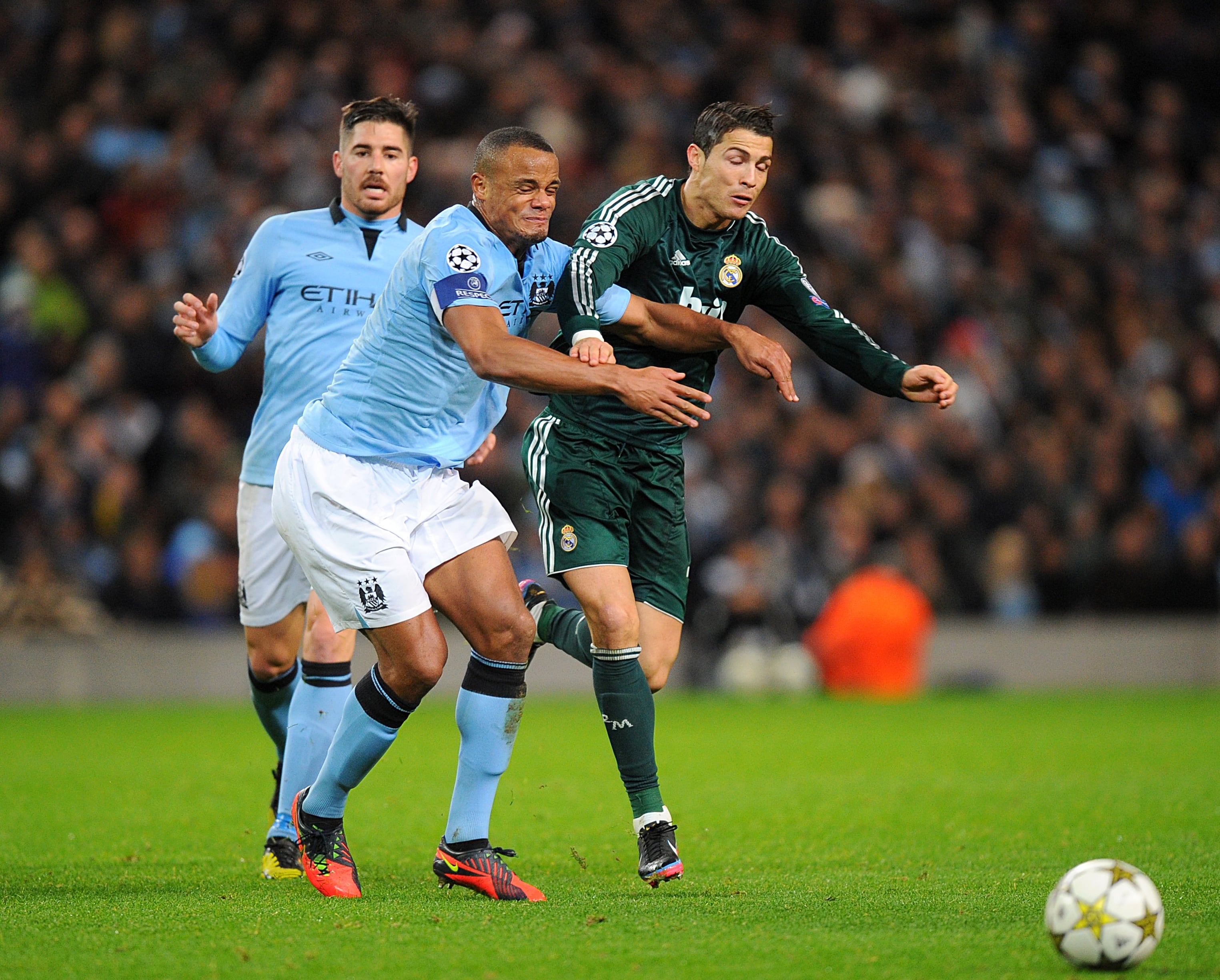 Manchester City's Vincent Kompany (left) and Real Madrid's Cristiano Ronaldo (right) battle for the ball   (Photo by Martin Rickett/PA Images via Getty Images)