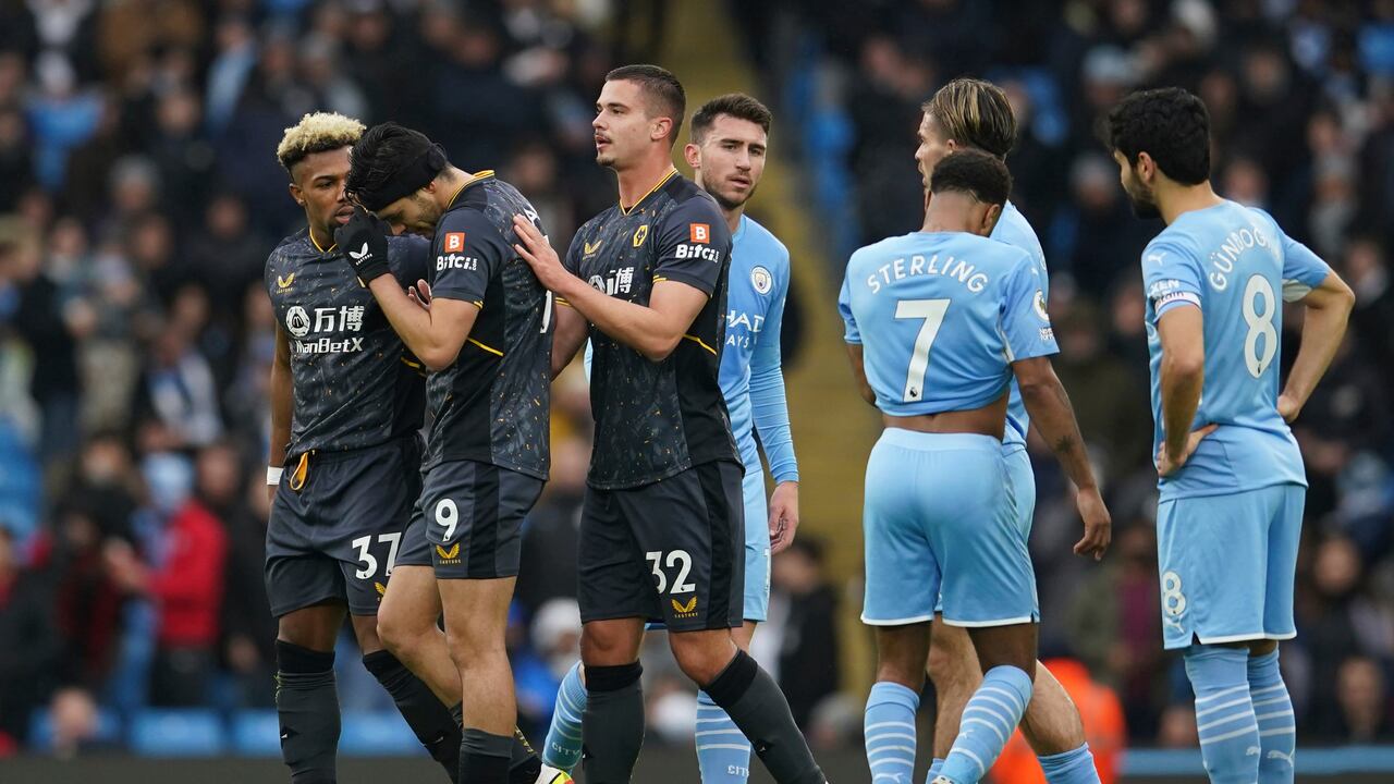 Wolverhampton Wanderers' Raul Jimenez, gestures after receiving a red card from referee Jonathan Moss during the English Premier League soccer match between Manchester City and Wolverhampton Wanderers